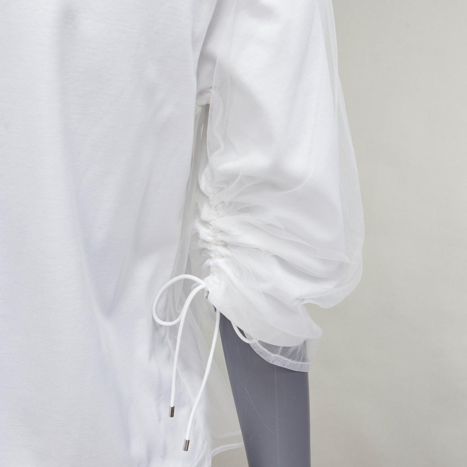 NOIR KEI NINOMIYA 2018 white cotton tulle overlay ruched sleeve tshirt XS
Reference: AAWC/A00753
Brand: Noir Kei Ninomiya
Collection: 2018
Material: Cotton
Color: White
Pattern: Solid
Closure: Pullover
Extra Details: Drawstring ruched details at