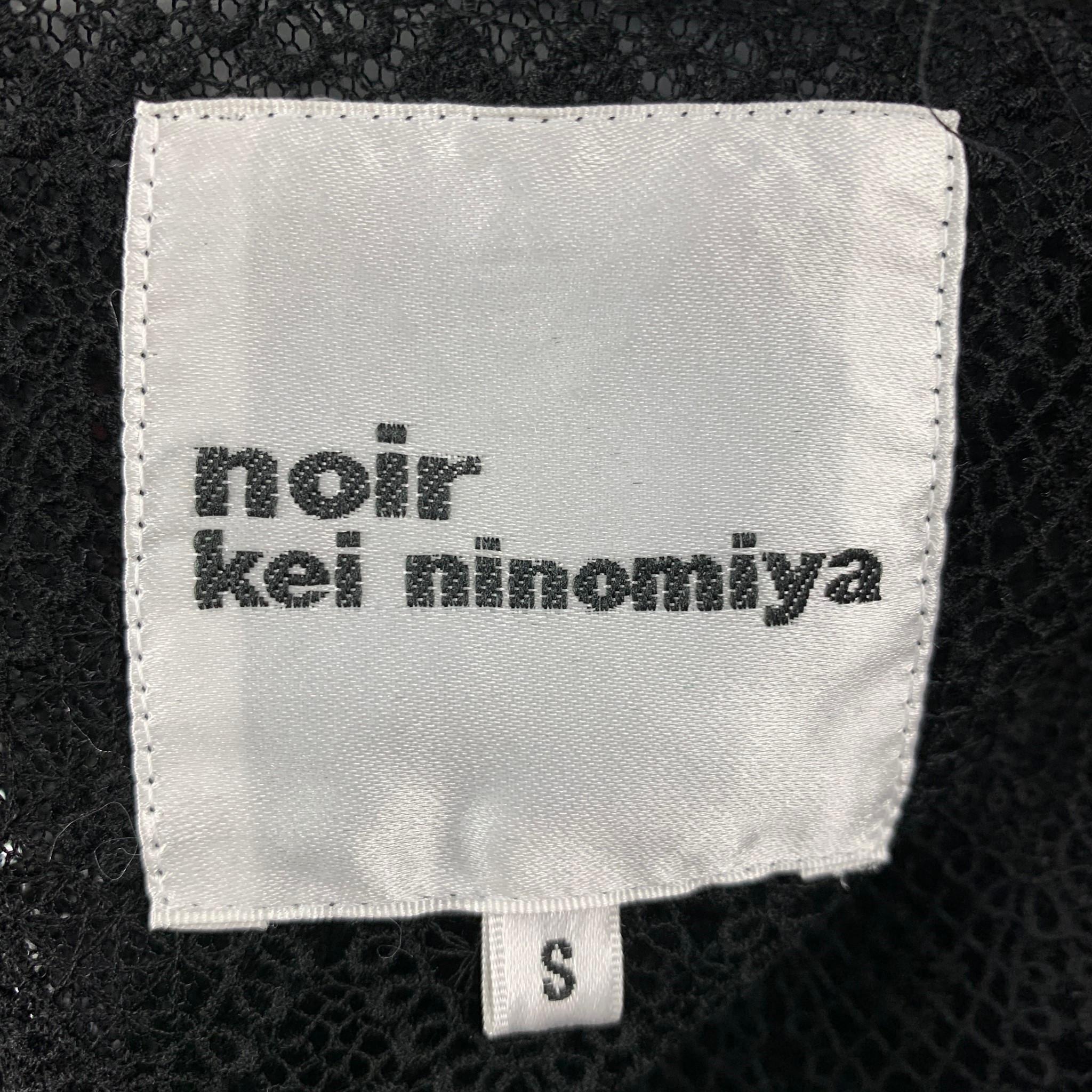 NOIR KEI NINOMIYA jacket comes in a black tulle see through material, lace trim, collarless, wide sleeves, leather trim, and a zip up closure. 

Very Good Pre-Owned Condition.
Marked: S

Measurements:

Shoulder: 15 in.
Bust: 36 in.
Sleeve: 24.5