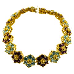 NOLAN MILLER signed gold plated crystal flower designer bracelet