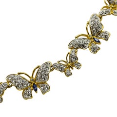 Collana firmata Nolan Miller con cristalli di zaffiro placcati oro e farfalla