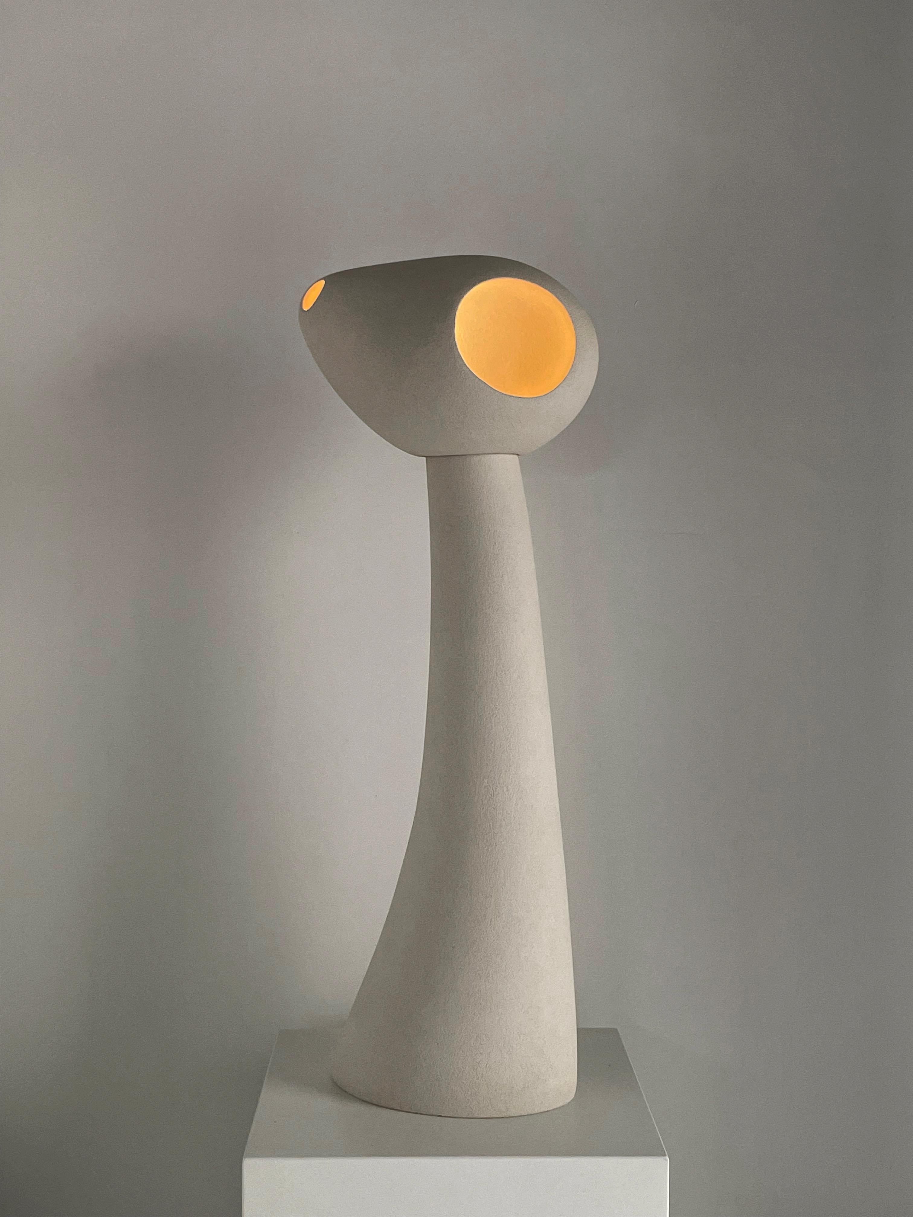 Nomad II:07 Lamp in White Sand Stoneware by Sofia Karnukaeva
Dimensions: D 31 x W 20 x H 75 cm.
Materials: Stoneware.

All our lamps can be wired according to each country. If sold to the USA it will be wired for the USA for instance. Please contact