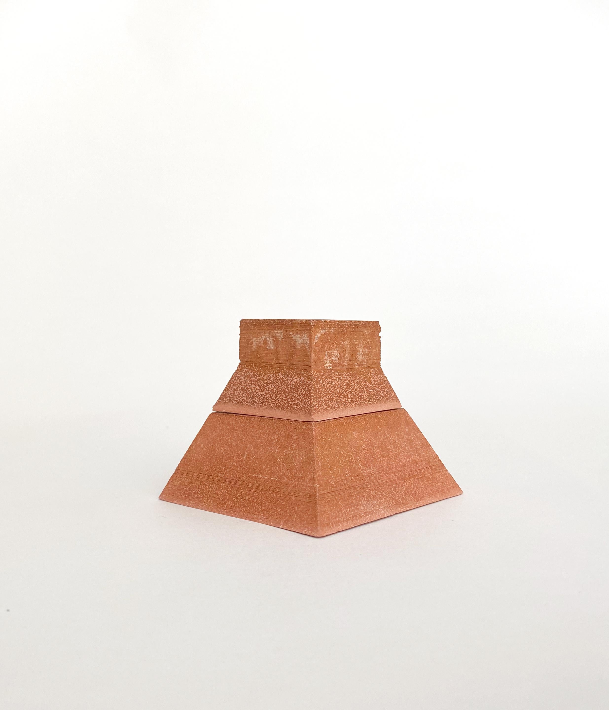 Nomad Jar Pyramide by Gilles & Cecilie
Unique
Dimensions: H 6 x W 7 cm
Material: terracotta with iron

Gilles and Cecilie Studio created the Nomad Jar Family to explore drawing in three dimensions. The series of objects that can stand alone or