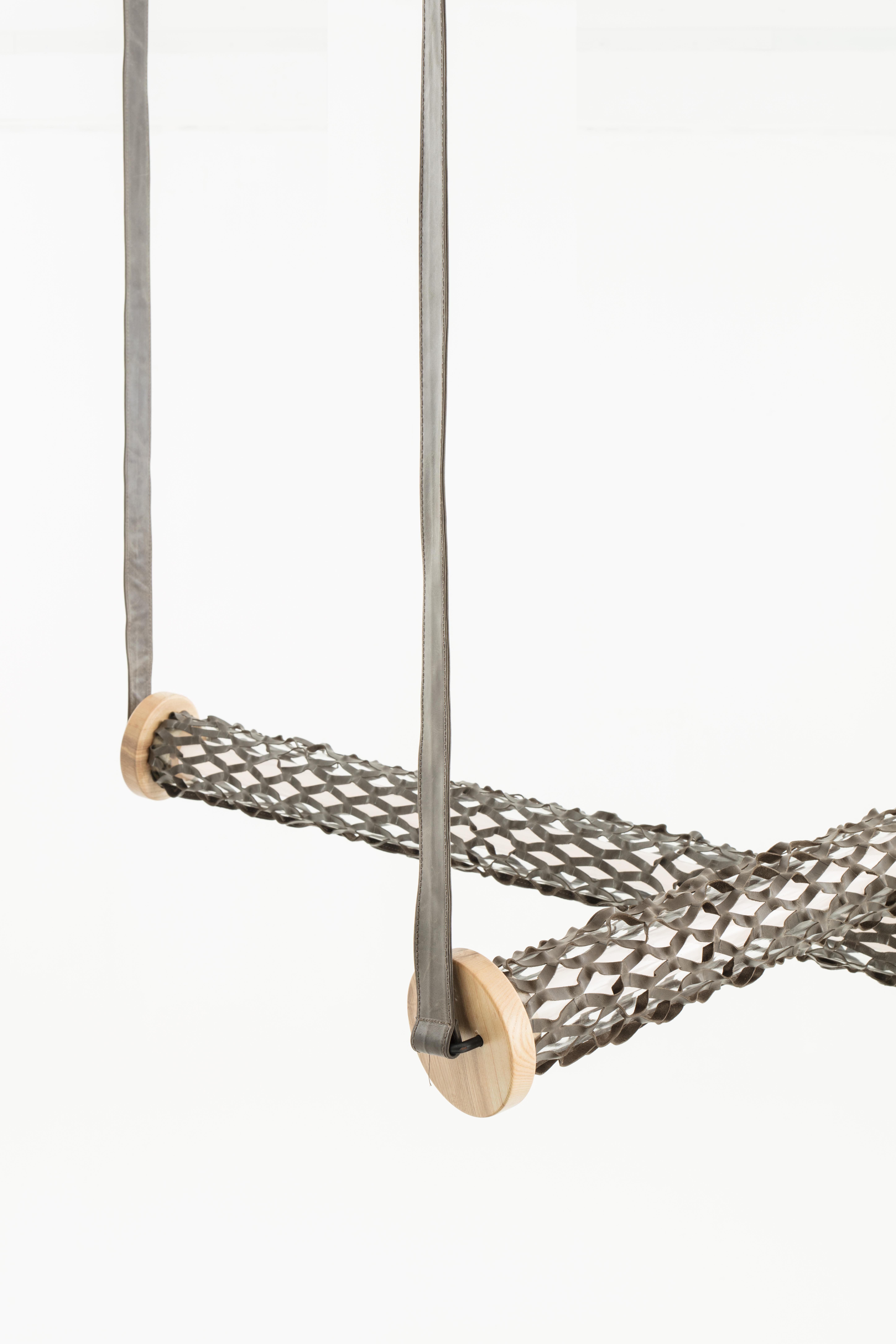 Nomad Mesh – A Symphony of Light and Craftsmanship
The Nomad Mesh lamp is a statement of refined elegance, combining modern craftsmanship with timeless materials. Encased in an exclusive, laser-cut yak-leather band, this unique design creates a