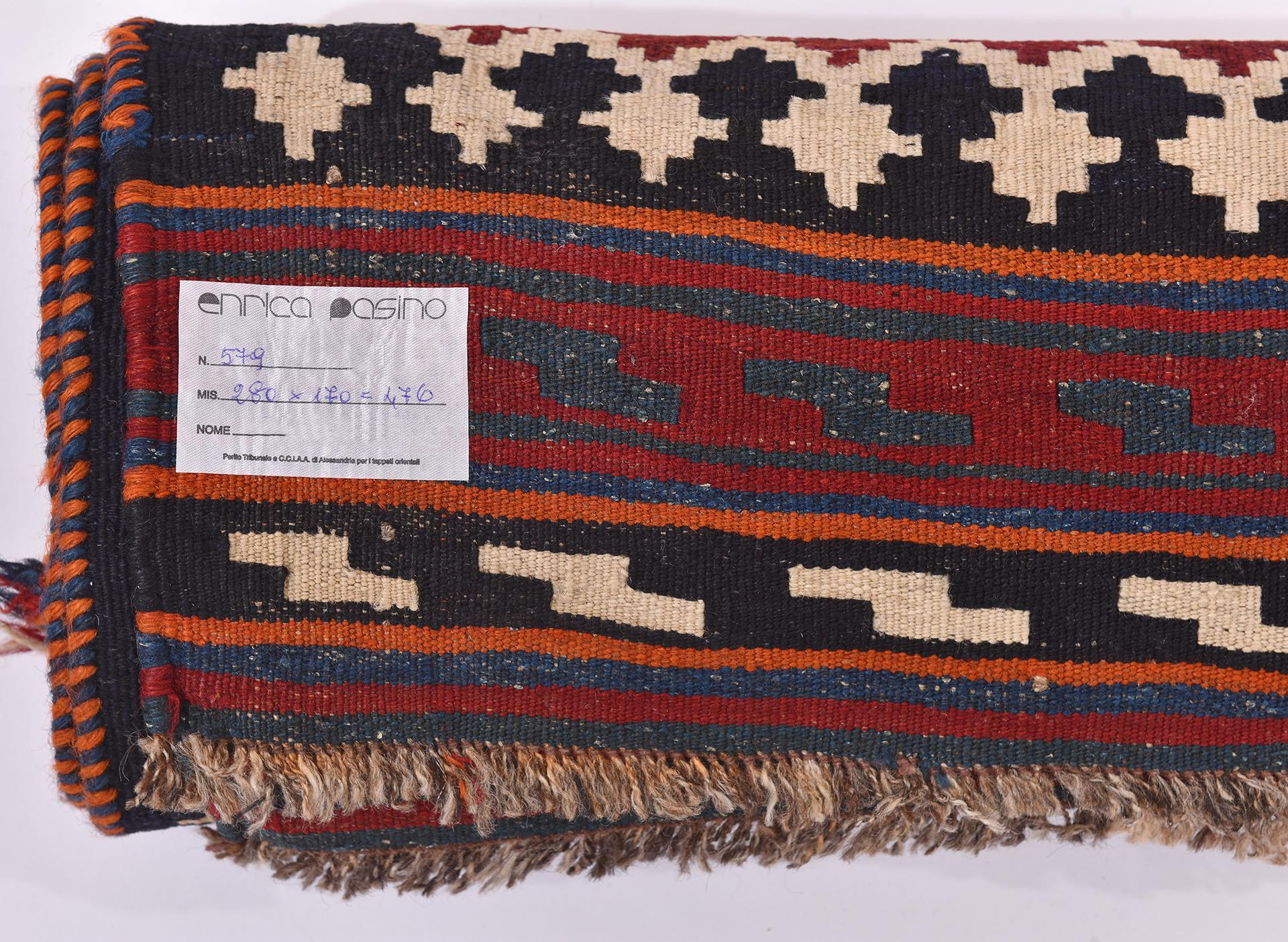 nr. 579 -  Very pleasant kilim, with a perfect workmanship and a strong geometric design white and blue on a red background.  Dense and accurate workmanship.
Now with a very good price for closing activities.