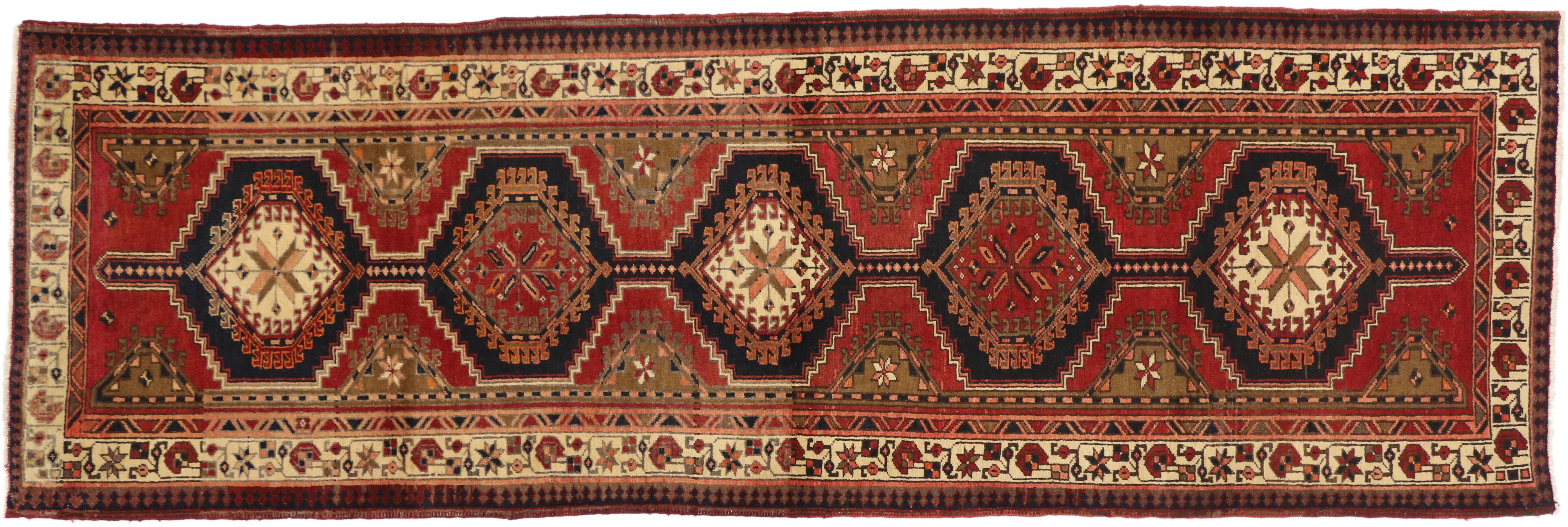 75372, Nomadic style vintage Persian Azerbaijan Tribal runner, hallway runner. Complete with nomadic style, warm and inviting, this hand-knotted wool vintage Persian Azerbaijan runner features five connected latch-hooked hexagonal pole medallions