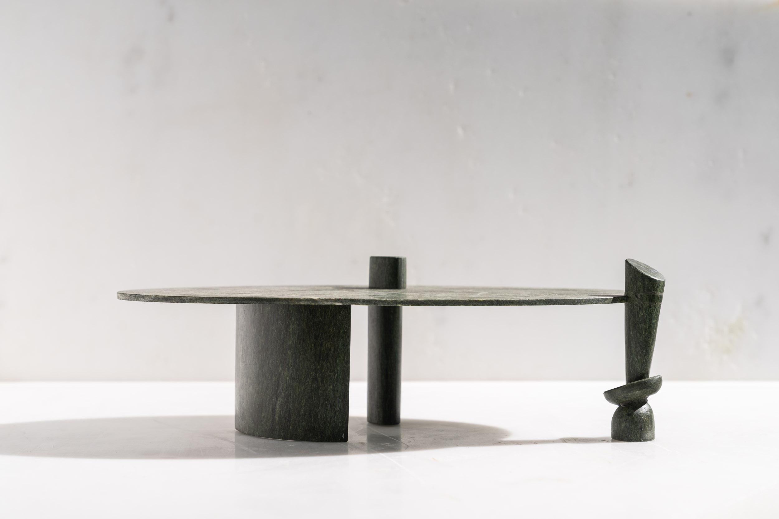 Nomads Sculptural Dining Table by ON.ENTROPY
Dimensions: W 290 x D 150 x H 75 cm
Materials: Green Marble.

on• entropy is a marble atelier established in 2009 in Athens and London with a focus on metamorphosis. Expanding from object to space