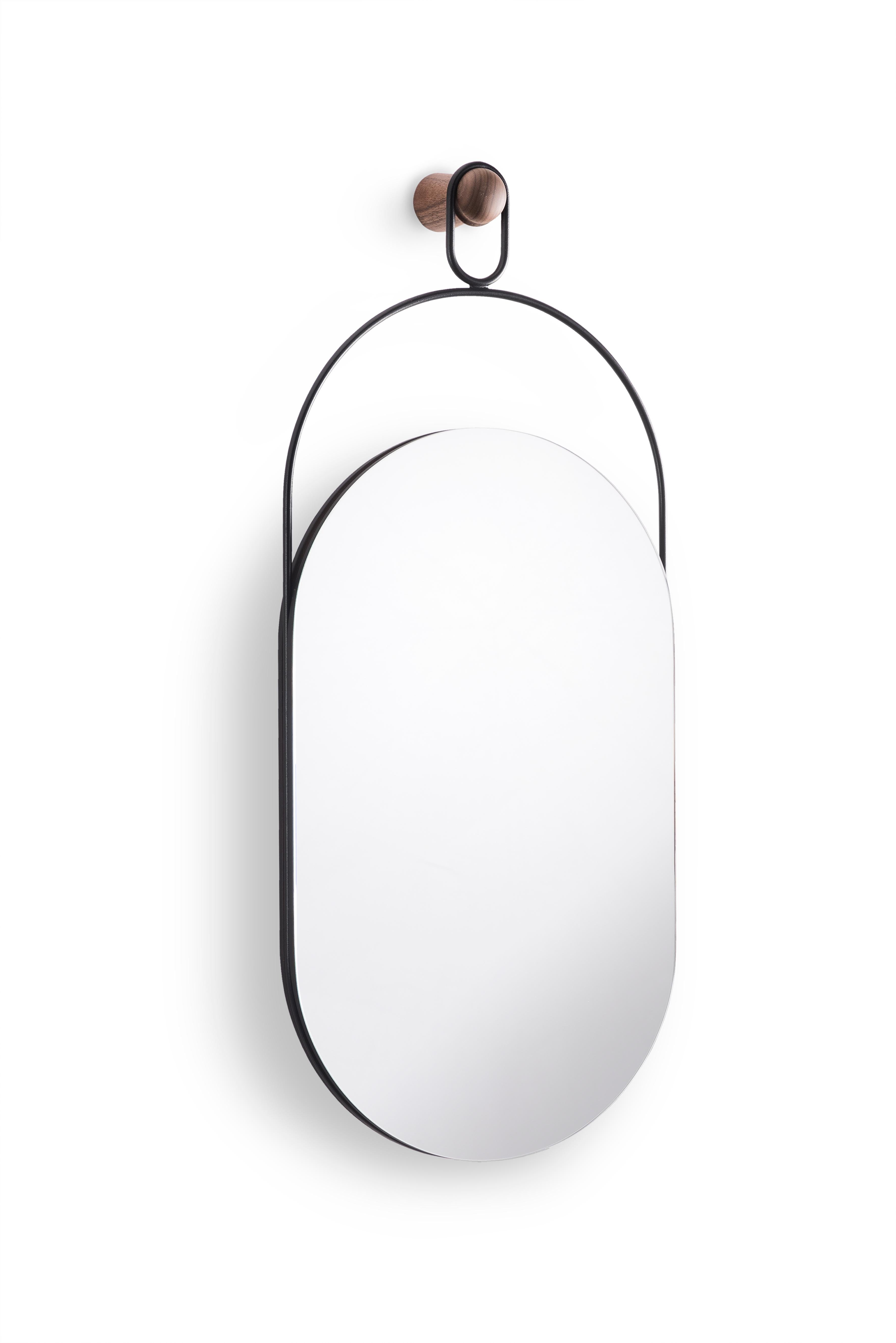Sophisticated mirror, inspired in jewelry design. 

Available in Walnut and Black