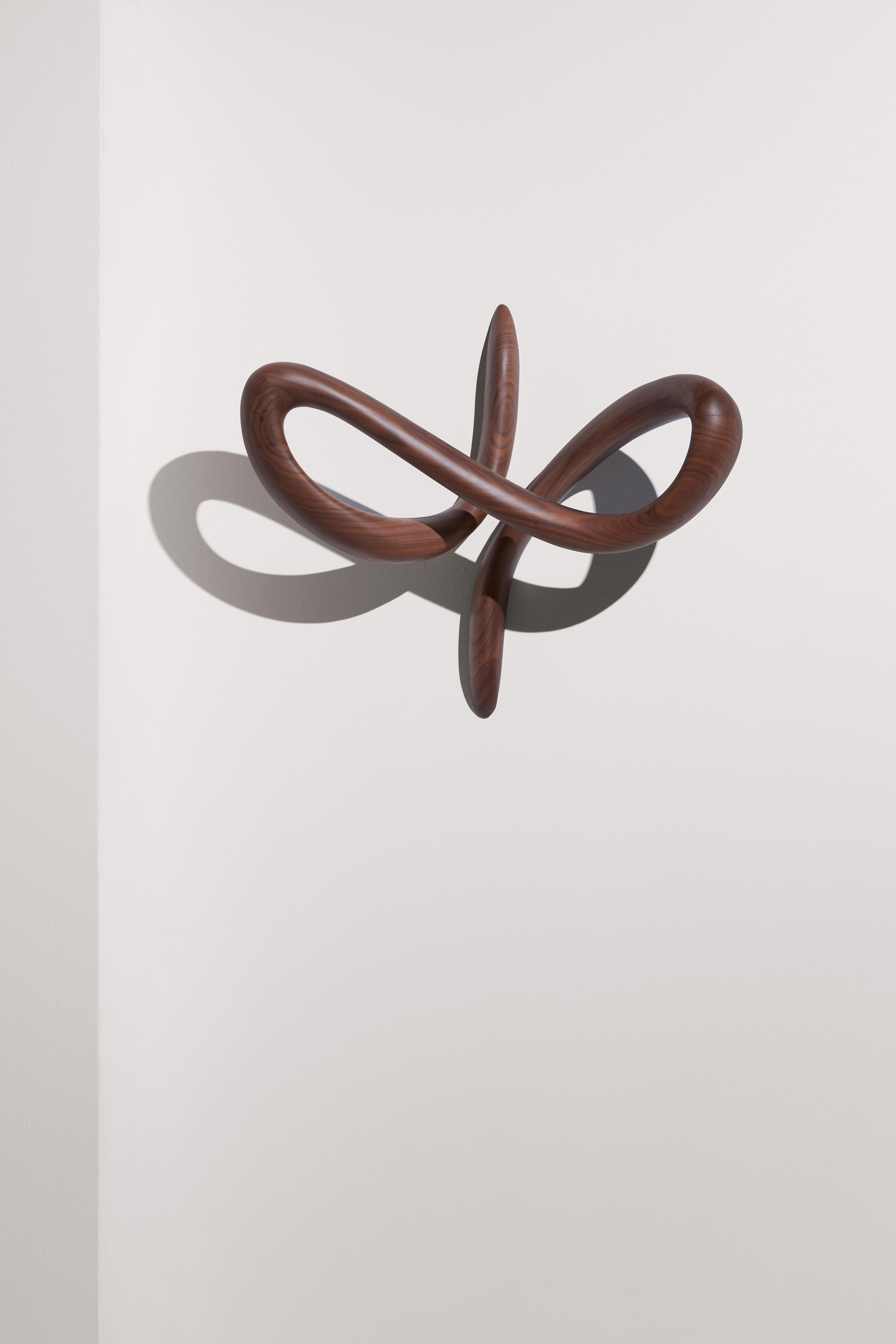 Timeless sculpture, its aesthetic function expresses a unique lifestyle.

Available in 
Walnut

Small and Large Size