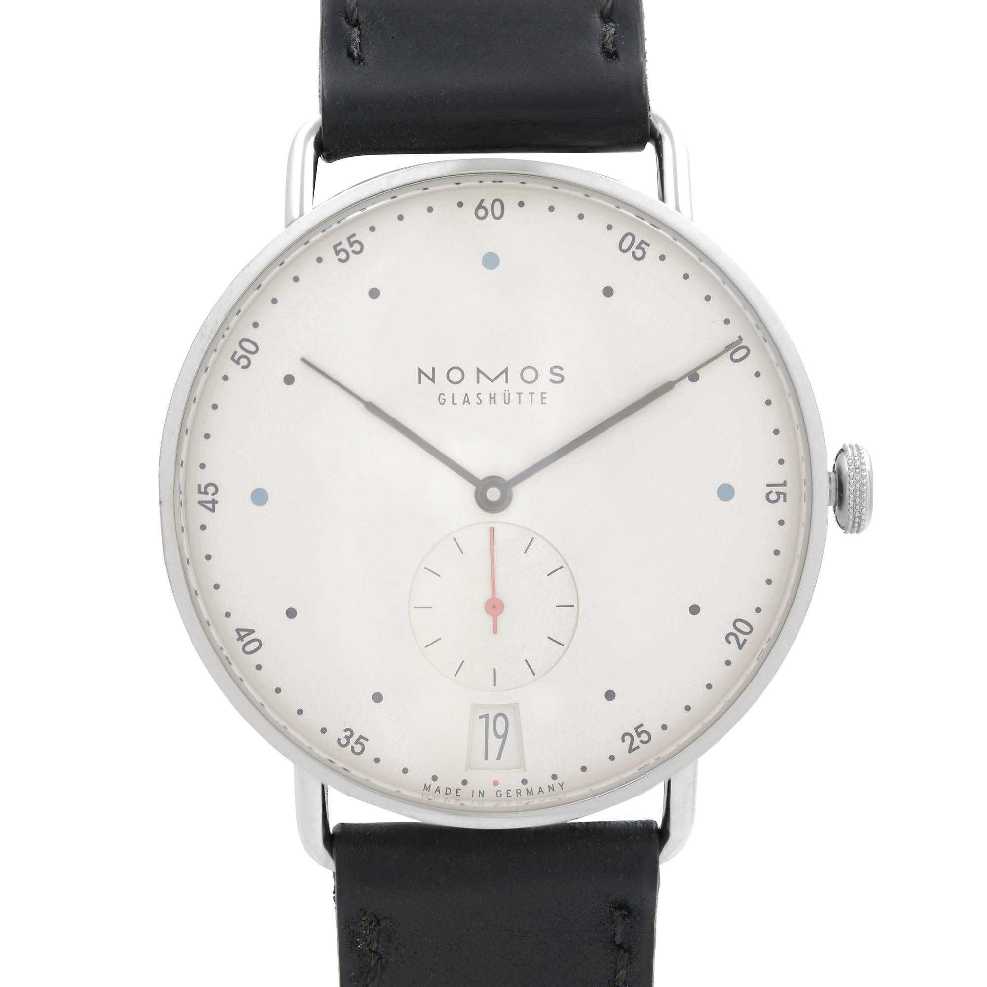 Pre-owned Nomos Glashutte Metro 38 Date Steel White Dial Hand Wind Men's Watch 1102. The Watch Case Has a Visible Dent on the Edge by 45 Dial Marker. The Watch Band Shows Minor Scuffs On the Inner Side. Original Paper Is Included. Comes with