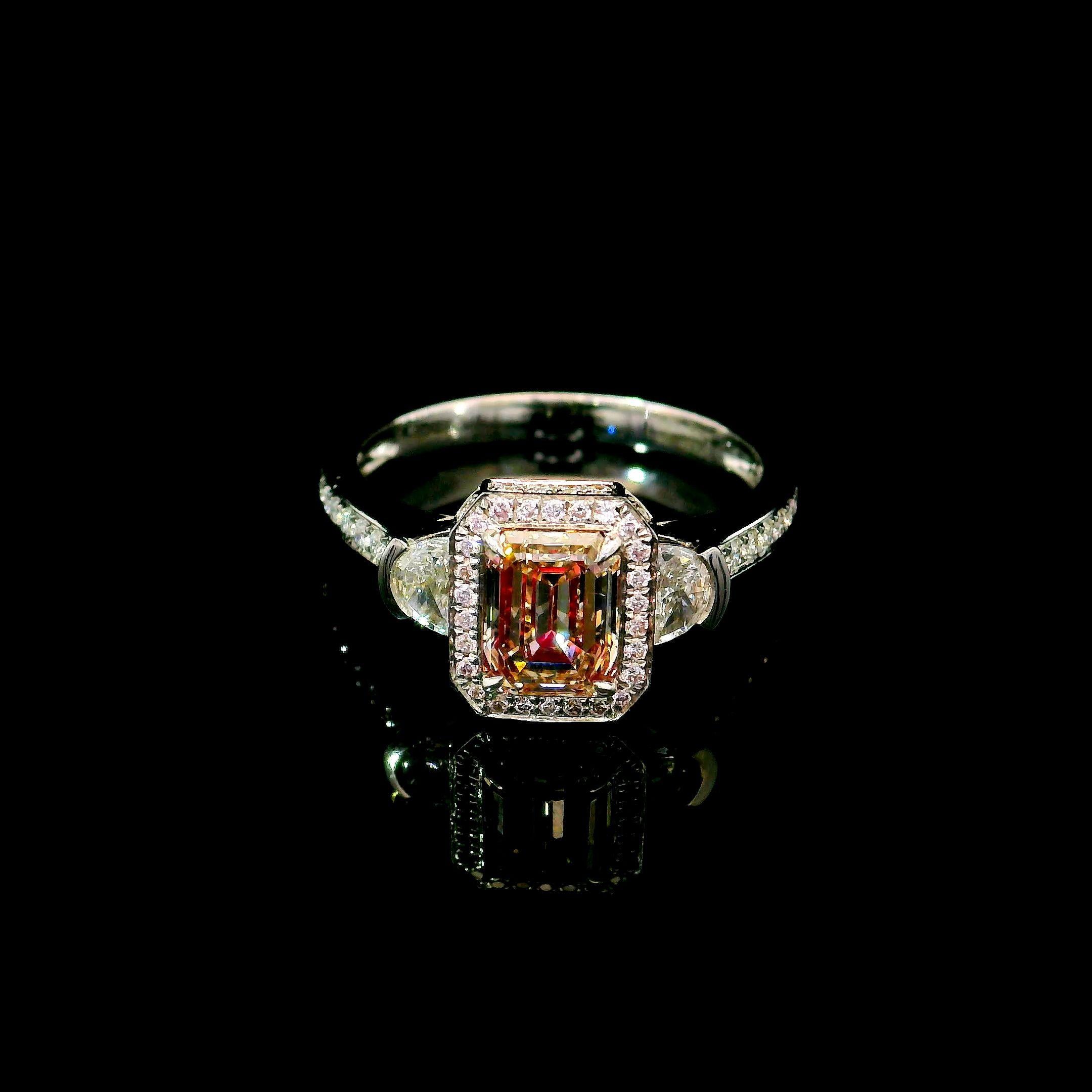 18kt white gold ring with diamonds
  
  Gold colour & karat: White gold 18kt
  Weight: 4.35 grams
  
  Set with-
  Stone type: Diamonds
  Shape: Emerald
  Carat: 1.04 ct
  Colour: Fancy Brownish Pink
  Clarity: VS2
  
  Surrounding Stones: Diamonds
