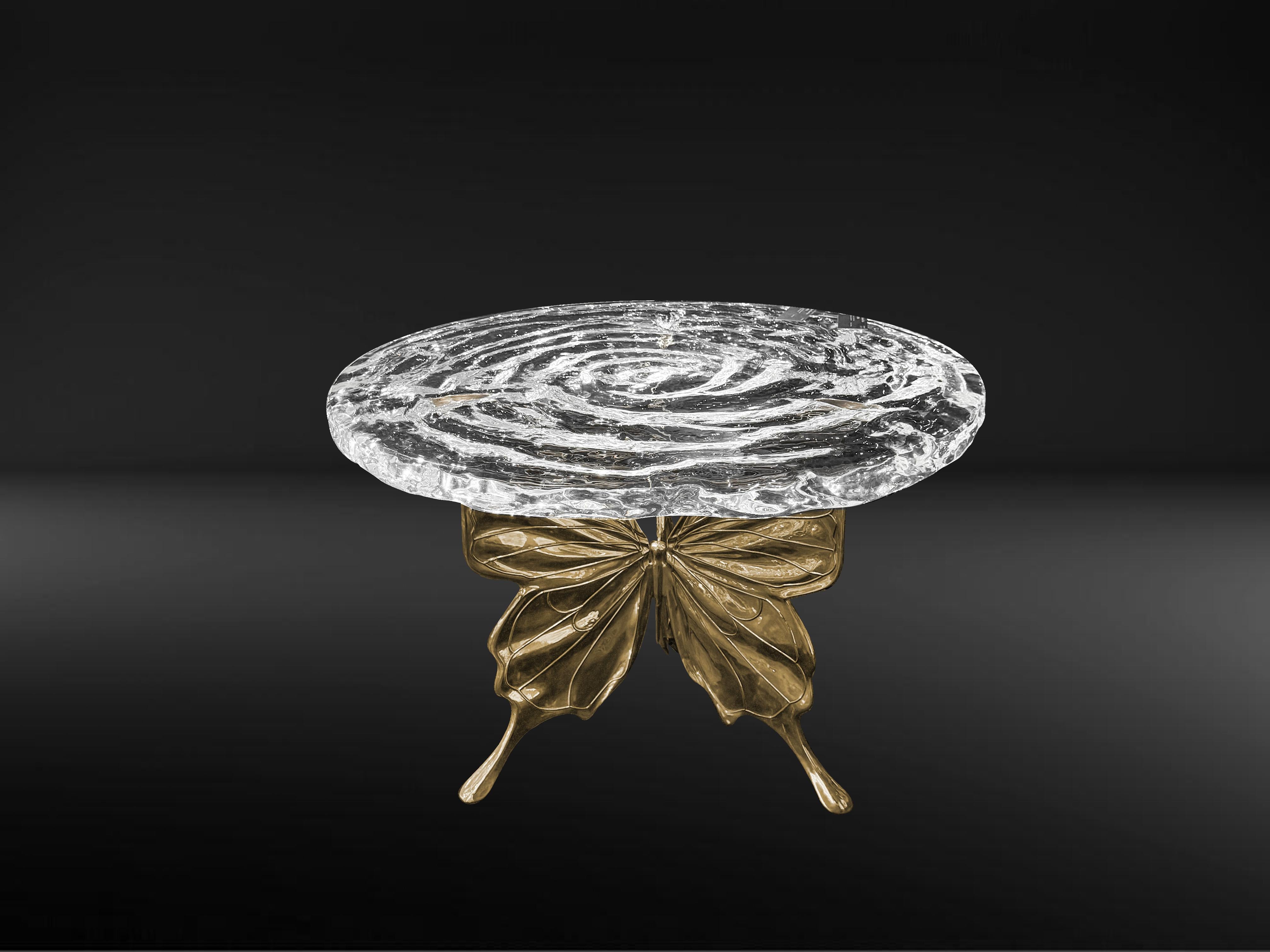 The design inspiration for the Papilio Round Table comes from the graceful posture of butterflies in nature and the dynamic moment of rippling water. Butterflies symbolize freedom and elegance, while water represents inclusiveness and purity. The