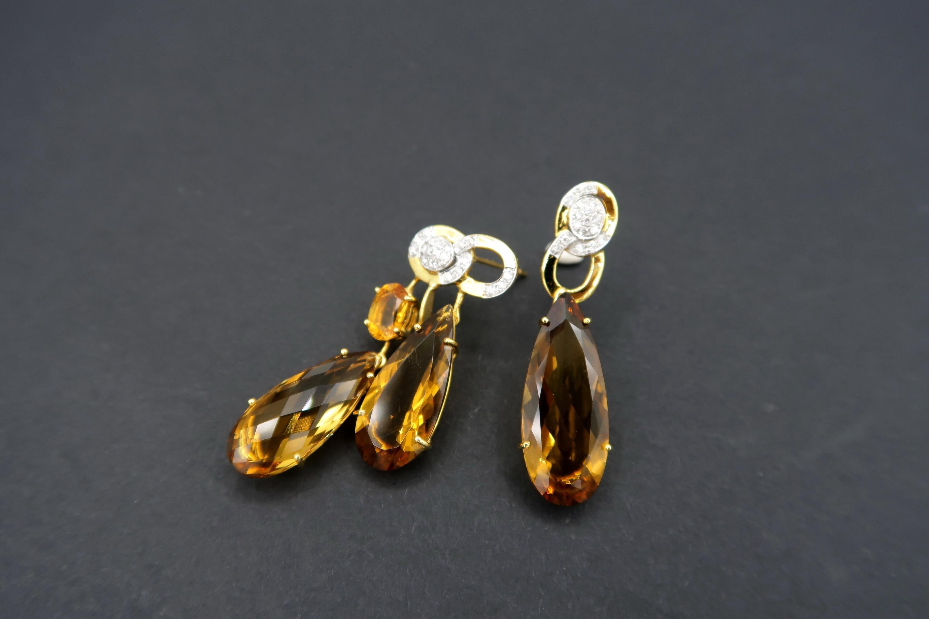 Nonidentical Drop Citrine and Diamond 18K Yellow Gold Pierced Earrings

Diamond: 0.23ct.
Citrine: 22.25cts.
Gold: 18K Yellow Gold 8.16g.