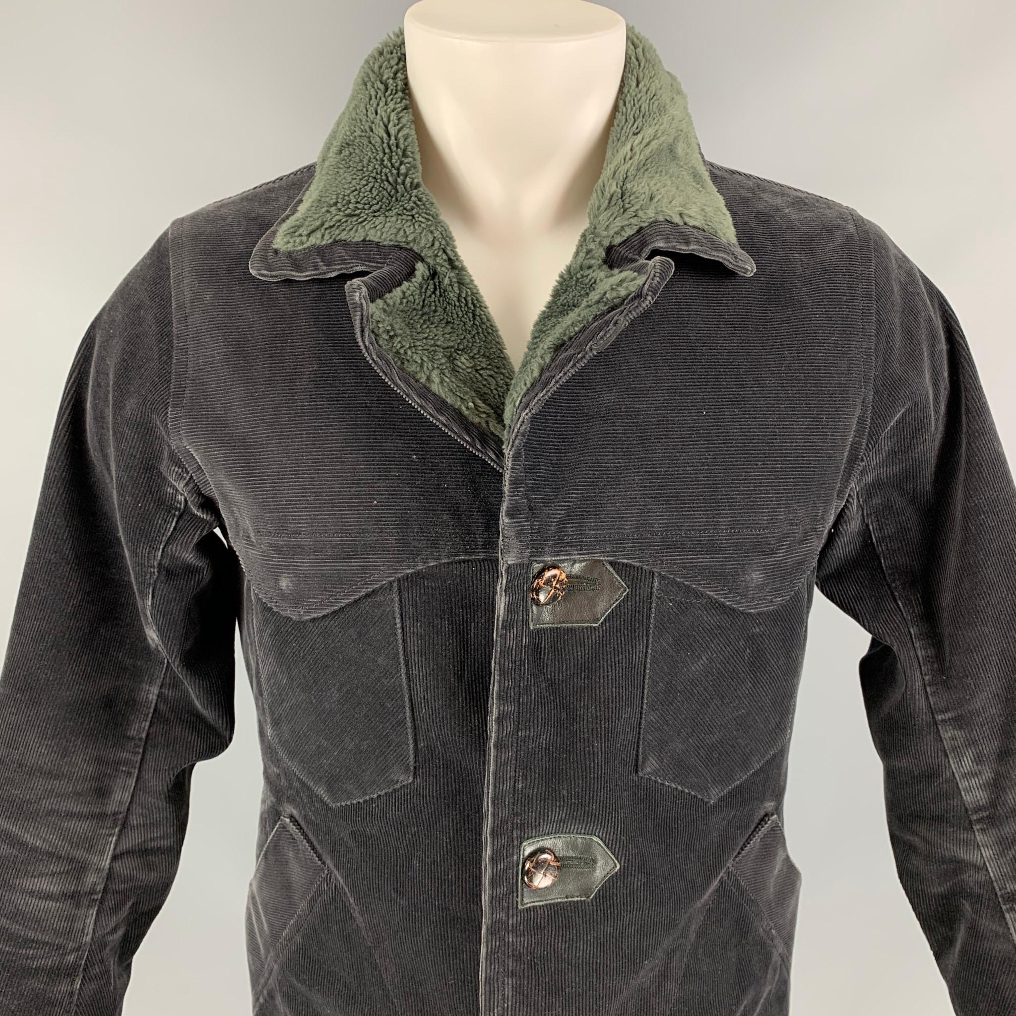 NONNATIVE jacket comes in a brown & green corduroy cotton with a faux fur liner featuring a gore-text material, leather trim, zipper sleeves, and a wooden button closure. 

Very Good Pre-Owned Condition.
Marked: 1

Measurements:

Shoulder: 16.5