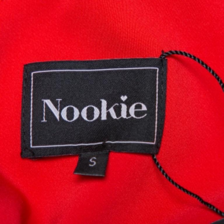 Masterful tailoring and a striking hue characterize this dress from the house of Nookie. Covered in a cherry red hue, this crepe sheathe dress is all about elegance and a flawless finish. It has a zip closure at the back and a scoop neckline.