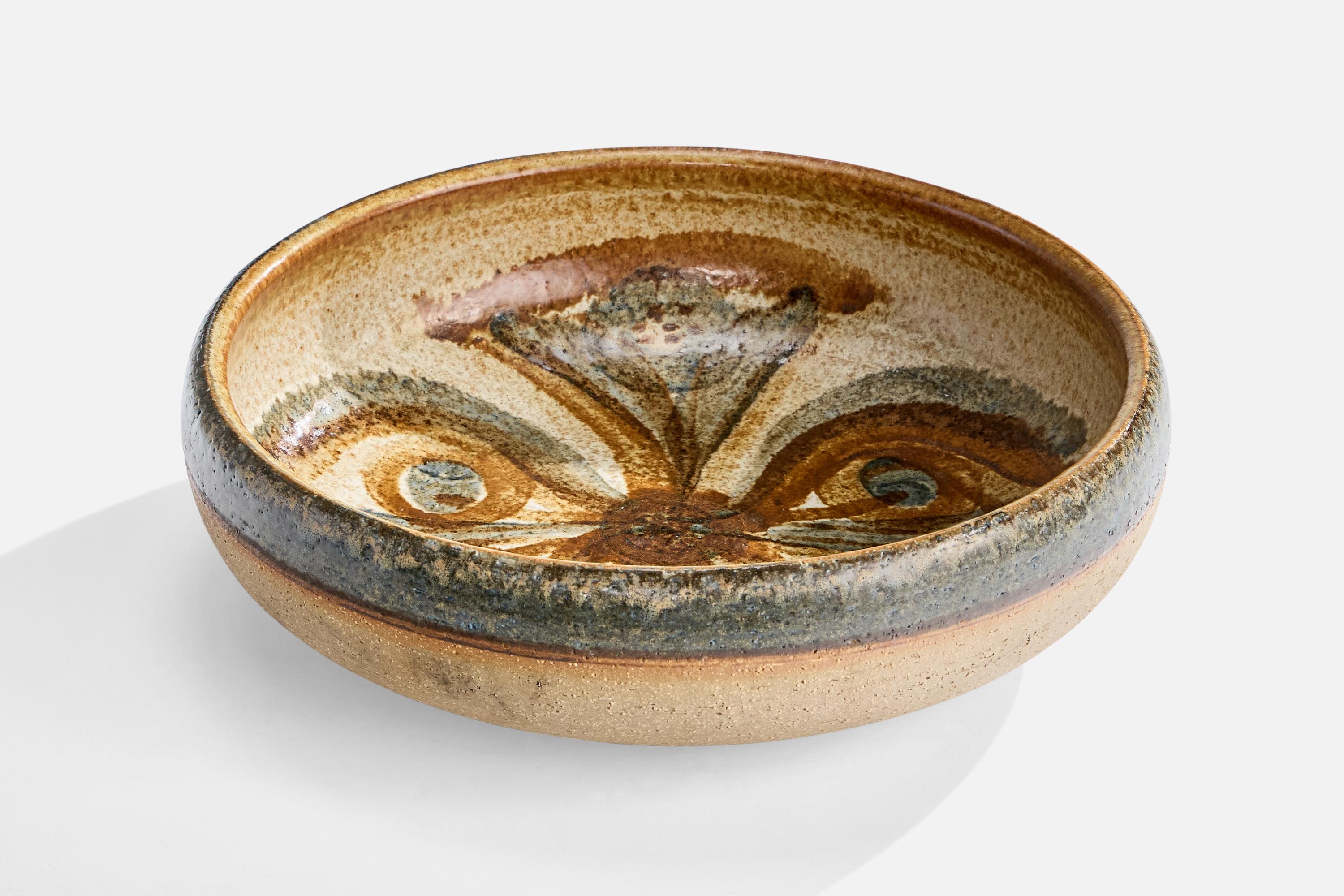 A green, brown and beige-painted stoneware dish, designed by Noomi Backhausen and produced by Søholm, Bornholm, Denmark, c. 1960s.

Overall Dimensions (inches): 3.25