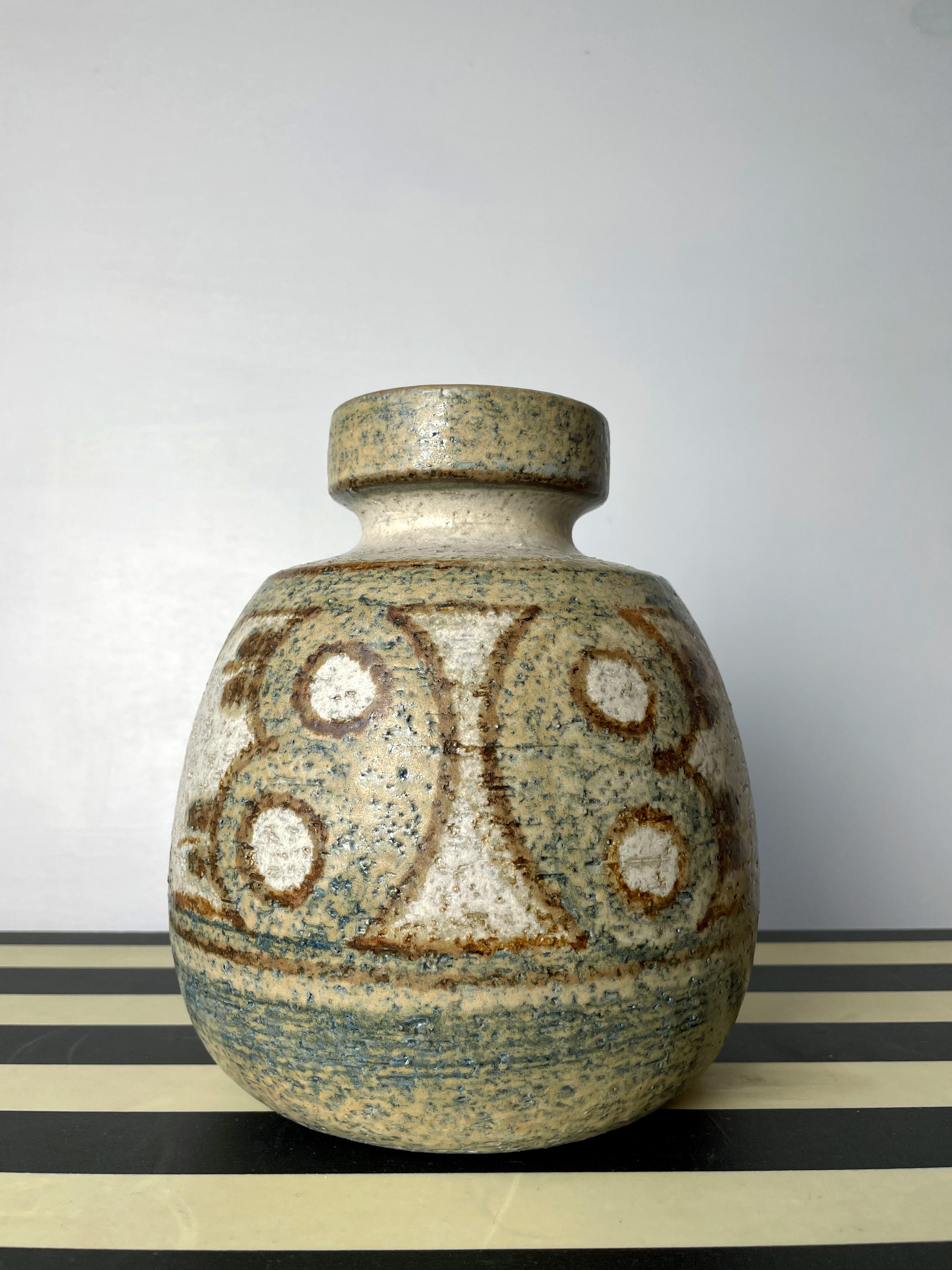 Handmade and handpainted Danish midcentury modern stoneware vase by Noomi Backhausen. Earthy colors in light brown, green and grays in organic symmetrical butterfly-like shapes around the belly of the vase. Manufactured by Søholm Stentøj on the