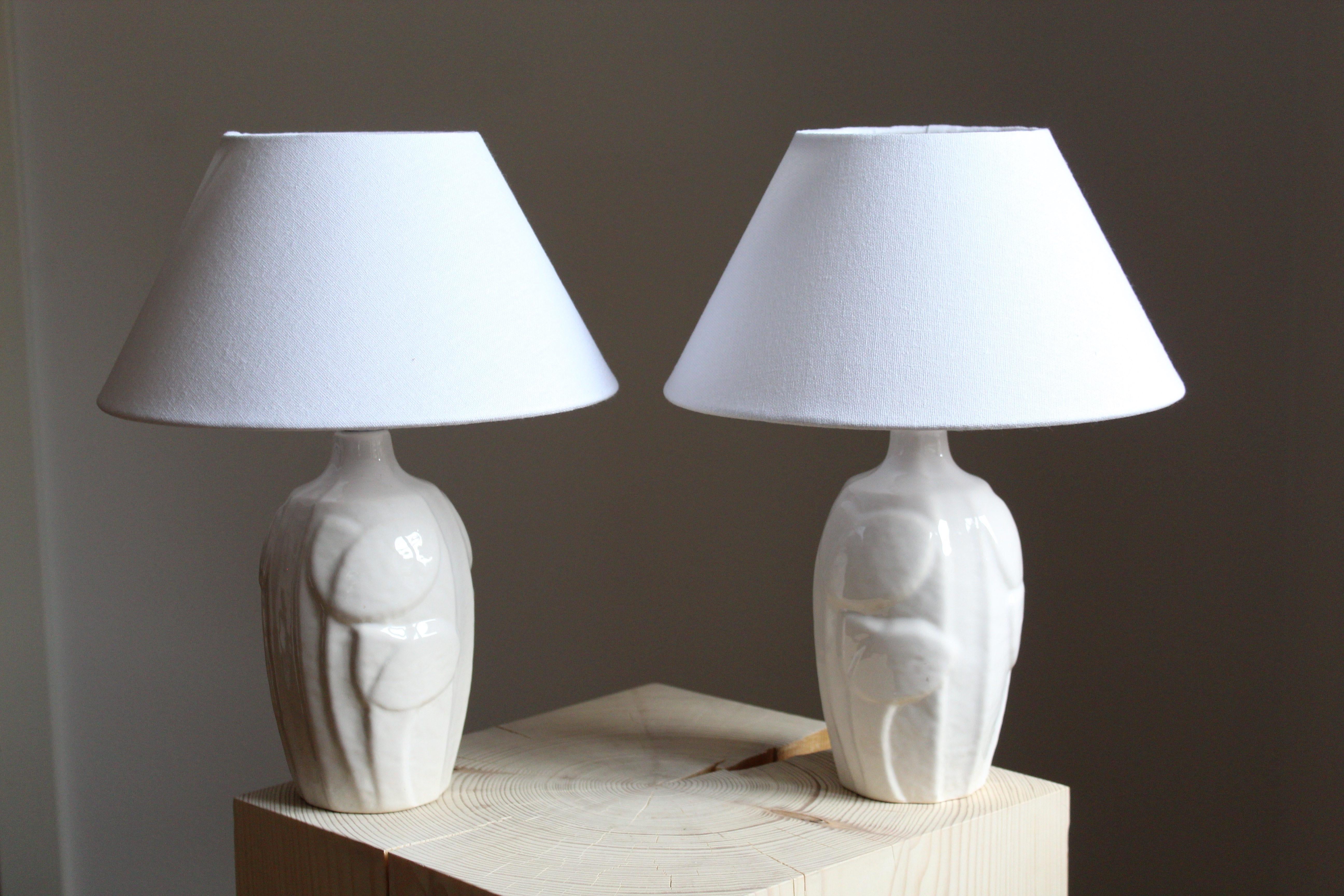 A pair of small table lamps produced by Søholm Keramik, located on the island of Bornholm in Denmark. Design by Noomi Backhausen. Marked and labeled. Lamps tone are identical, the shift in the image is due to lighting. 

Brand new lampshades.
 