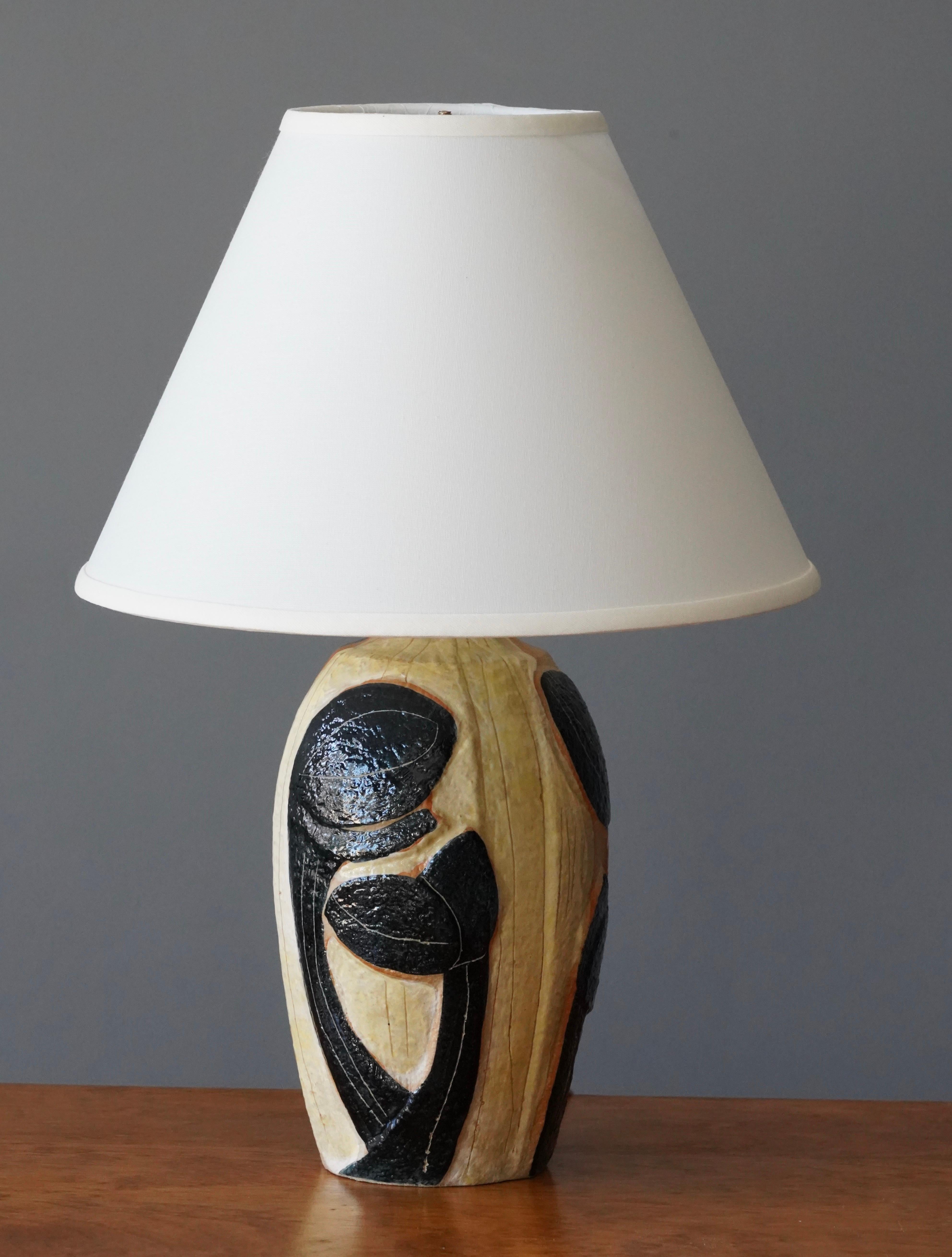 A table lamp produced by Søholm Keramik, located on the island of Bornholm in Denmark. Design by Noomi Backhausen, signed. Lampshade not included. Stated dimensions exclude lampshade, height includes socket.

Illustrated dimensions with shade are