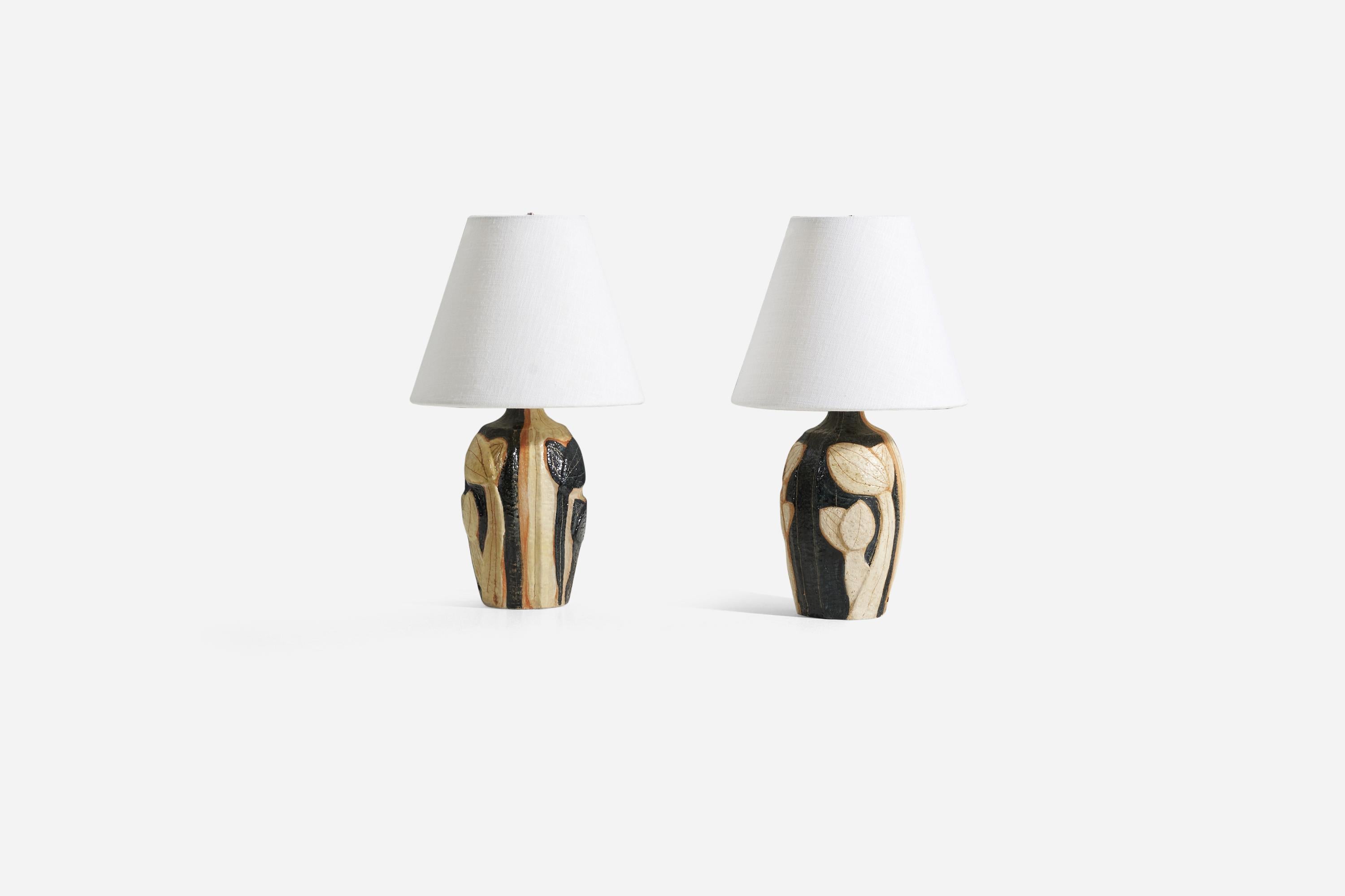 A pair of table lamps produced by Søholm Keramik, located on the island of Bornholm in Denmark. Design by Noomi Backhausen, signed. 

Dimensions listed are without lampshade. Sold without lampshades.
Shade : 4 x 8 x 6.5 (T x B x S) 
Measurement