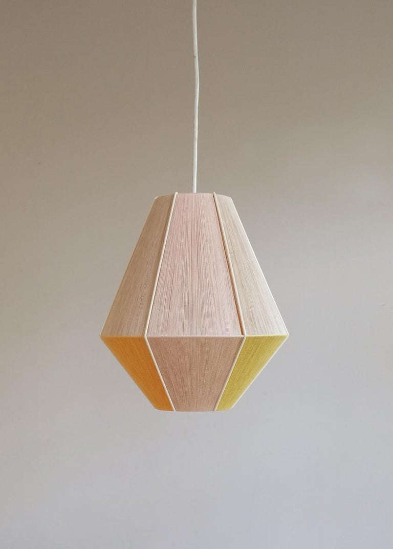 The designer Wera Jane shows a skilful revival of the 1970s with her unique lampshades. All of the lamps are unique and made to order. They are handwoven by herself in her studio in Leipzig, Germany. These Pendants are made of painted metal and