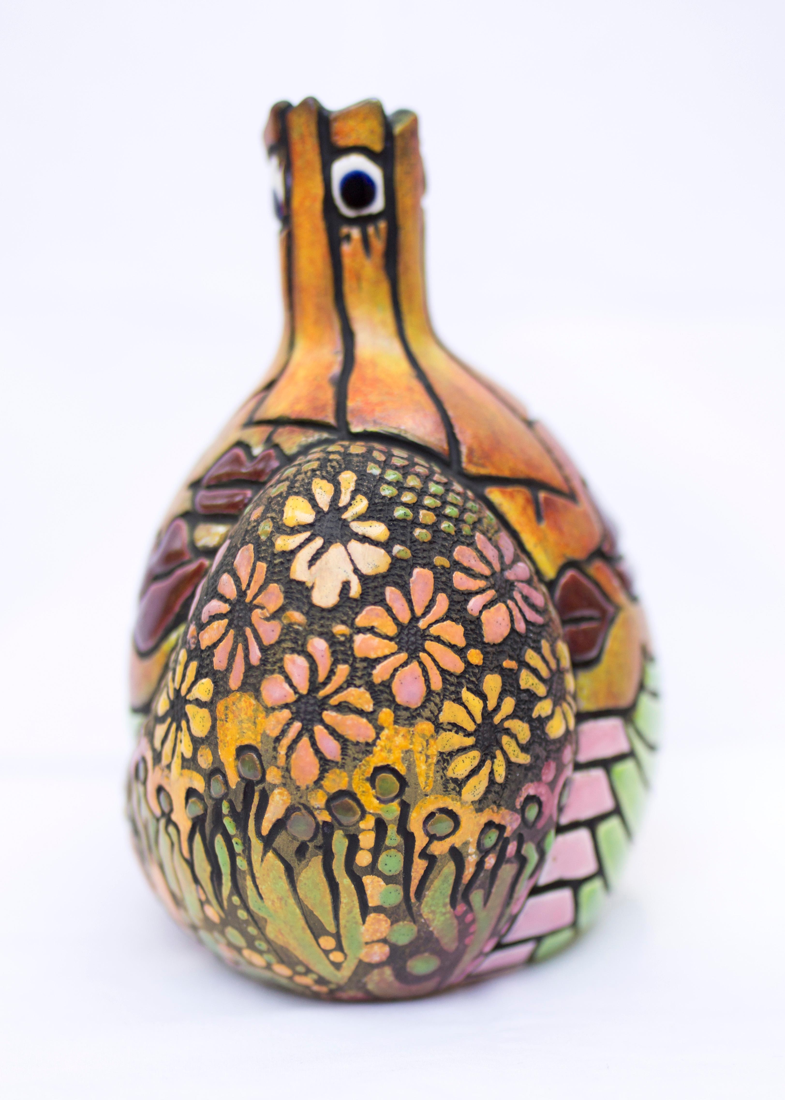 Fired to cone 01. Glaze fired to cone 07. Low fire glaze applications.

ARTIST STATEMENT

My work passionately reflects my Mexican cultural roots. The art forms appear and are created as stories in the round as I transform and mutate a magic fusion