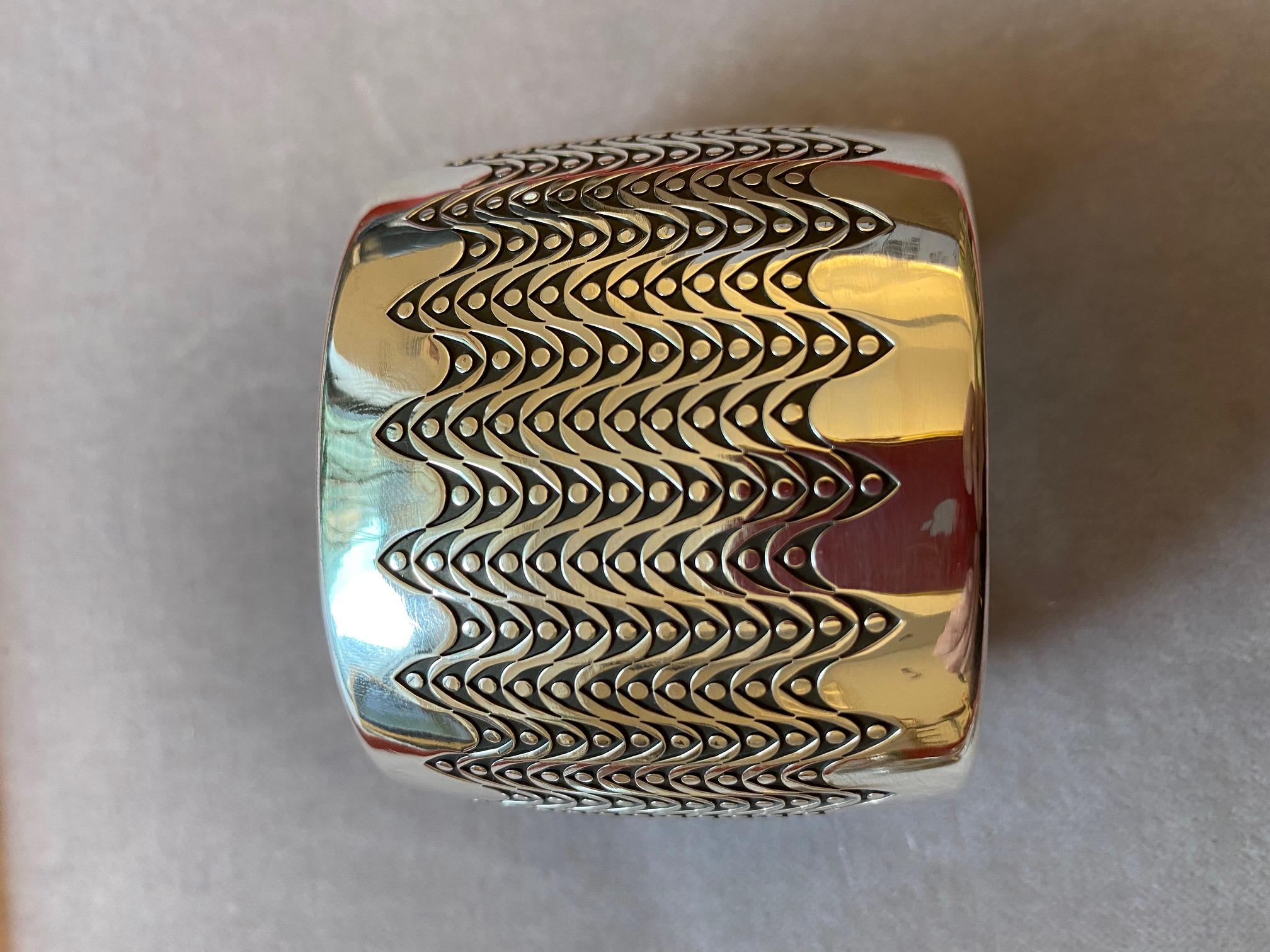 A sterling silver wave pattern cuff, by Norbert Peshlakai, Navajo. Norbert Peshlaki maker's mark. 

This cuff is 1.125
