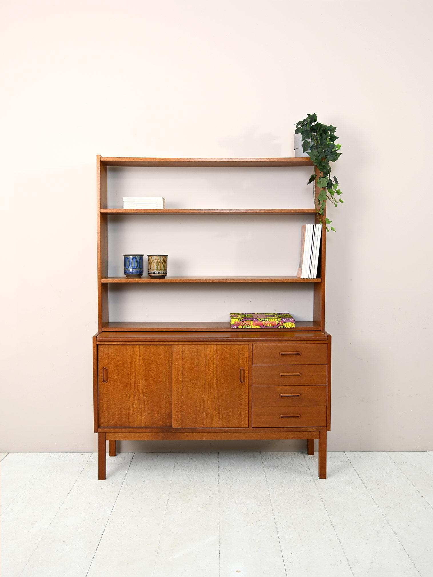Vintage 1960s sideboard with shelving and pull-out top.

Swedish modern antique teak cabinet.
The lower part is a small sideboard equipped with sliding doors and 4 drawers. The pull-out top allows it to be transformed into a worktop for smart