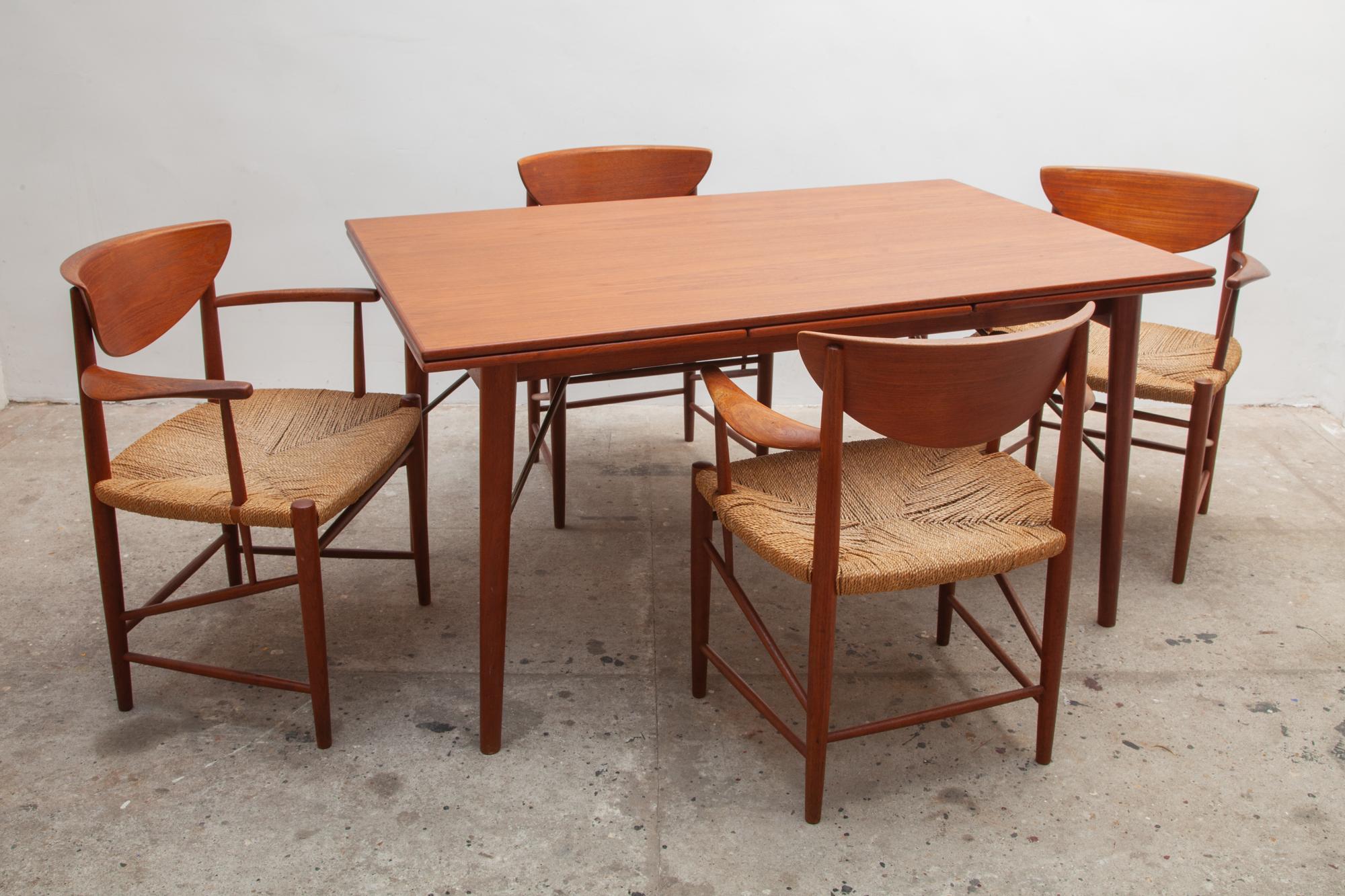 Beautiful dining table set by Peter Hvidt and Orla Mølgaard-Nielsen for Søborg Møblefabrik.Includes an extendable table with
self-storing leaves on each end, quality of the extendable table is exceptional with solid teak and brass supports legs