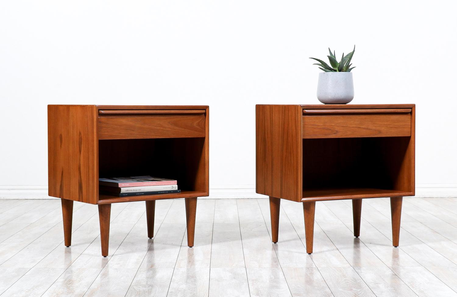 Scandinavian Modern Night Stands manufactured in Norway by Westnofa Furniture circa 1960’s. This pair of beautiful nightstands features a teak case sitting on solid tapered legs. Both items contain a dovetailed drawer with a sculpted handle and an