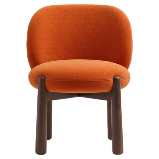 This chair embodies a blend of Nordic elegance and ergonomic comfort. Its design is a testament to the beauty of simplicity, with the smooth, rounded shapes of the backrest and seat creating a soft, inviting aesthetic. The streamlined wooden
