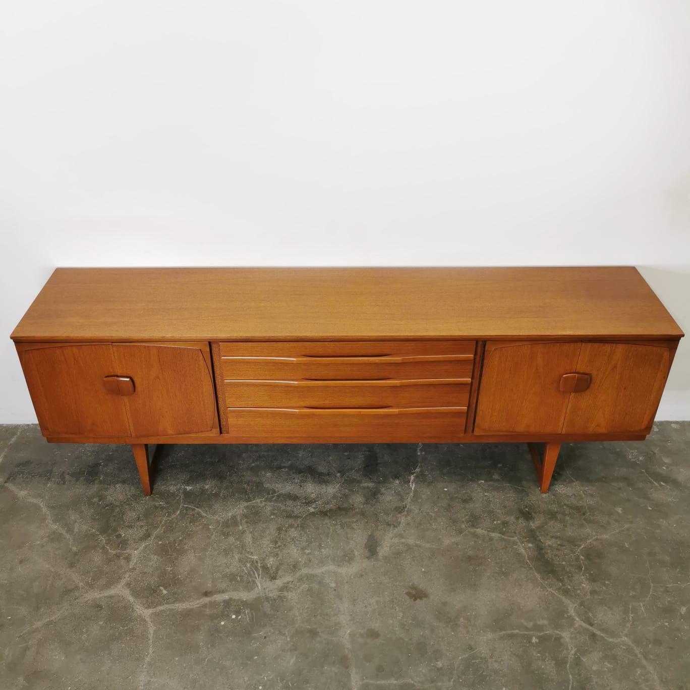 Immerse yourself in the natural beauty and minimalist charm of a Nordic wood sideboard, a stunning piece that embodies modern design principles. Crafted from high-quality wood, this sideboard showcases clean lines, sleek proportions, and a flawless