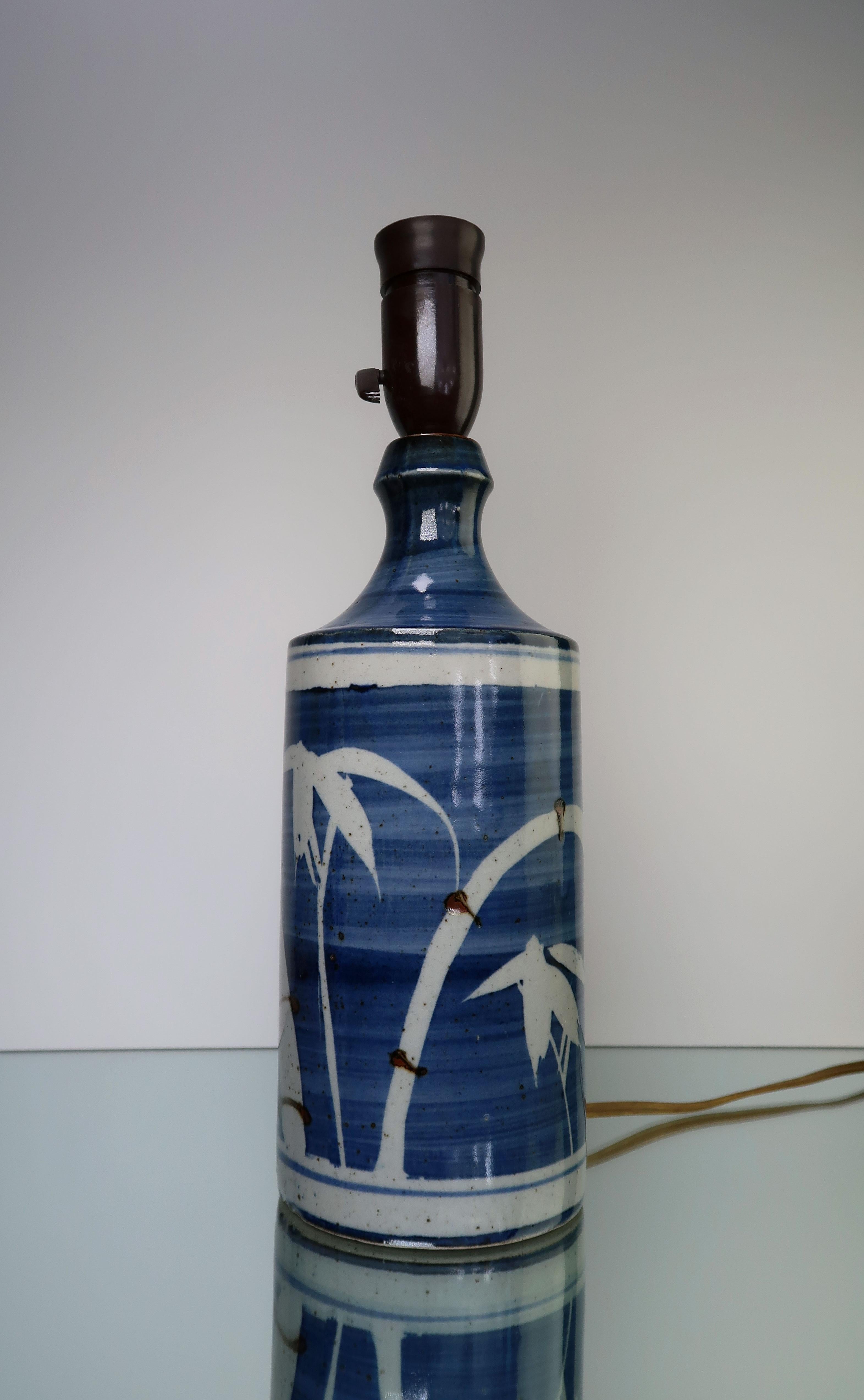 Distant shores. Japanese, tropical style Scandinavian Modern ceramic table lamp with glaze in white, light and dark blue. White palm trees over blue striped glaze with chocolate brown accents. Original fitting with switch. Beautiful vintage