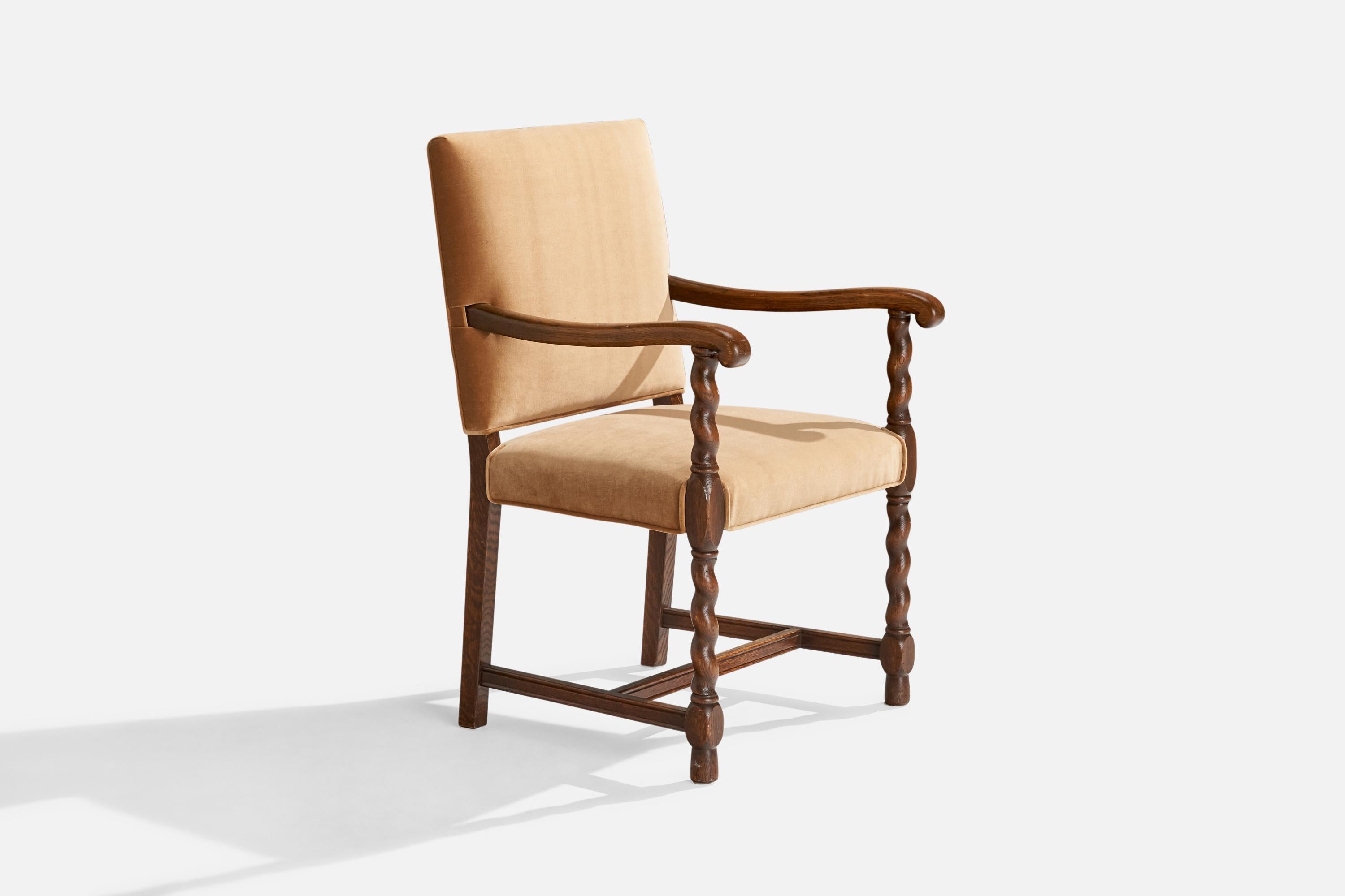 An oak and brown velvet armchair, model Gillberga, produced by Nordiska Kompaniet, Sweden, 1920s.

Seat height 19”. 
