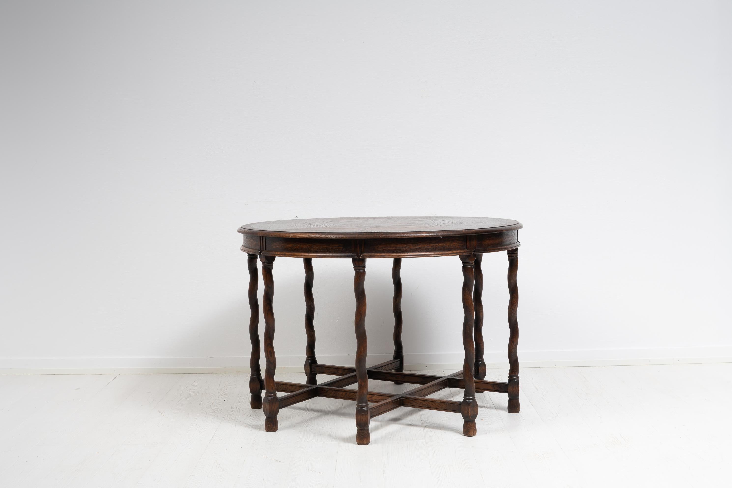”Baldwin” table for Nordiska Kompaniet from the early 20th century. The table is stained oak and made in baroque style in the year 1929. The table would work well as a centre or salon table with its round table top and turned, linked legs. Marked AB