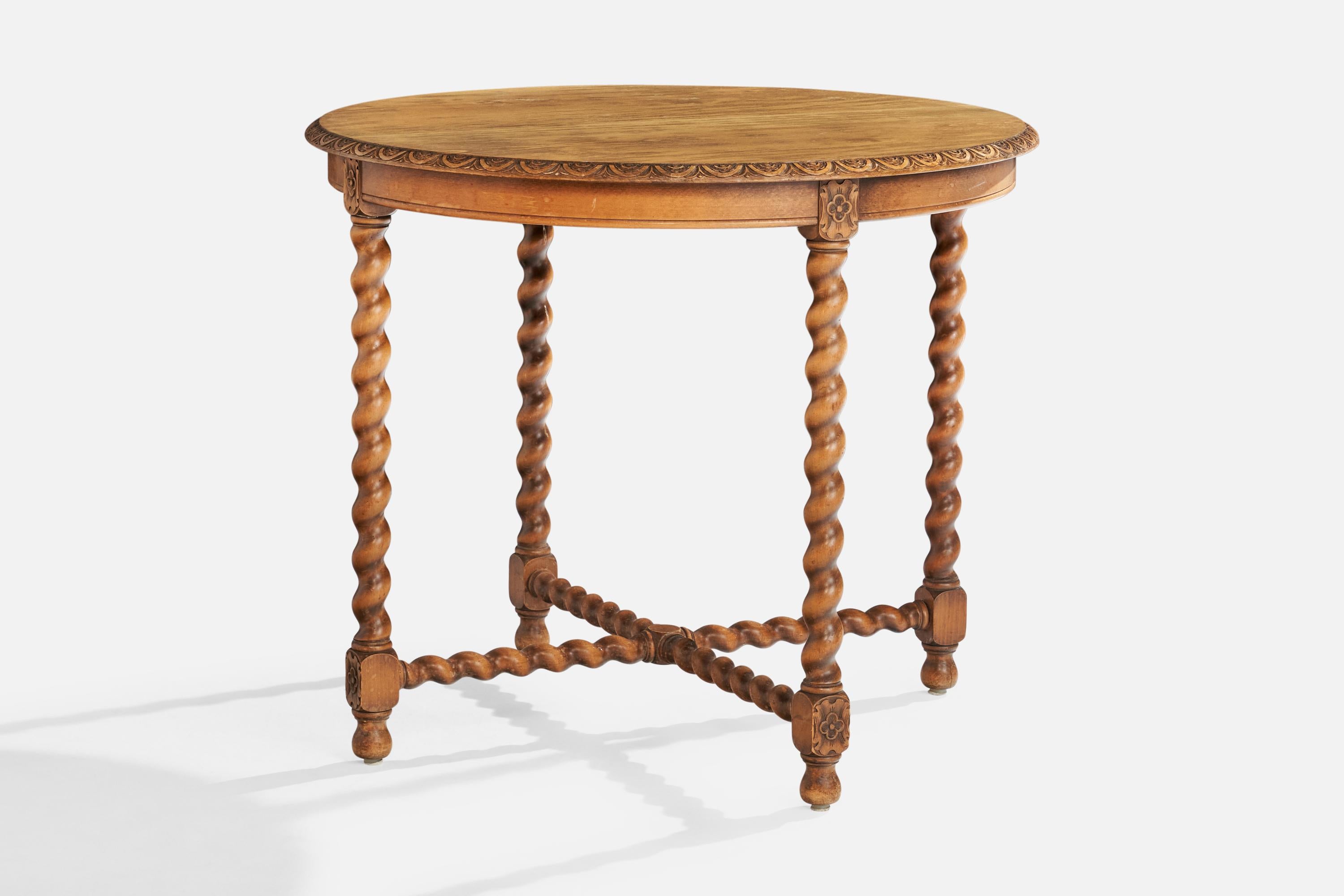 An oak center or side table produced by Nordiska Kompaniet, Sweden, c. 1920s.

Dimensions: 27.5” H x 31.7” Diameter