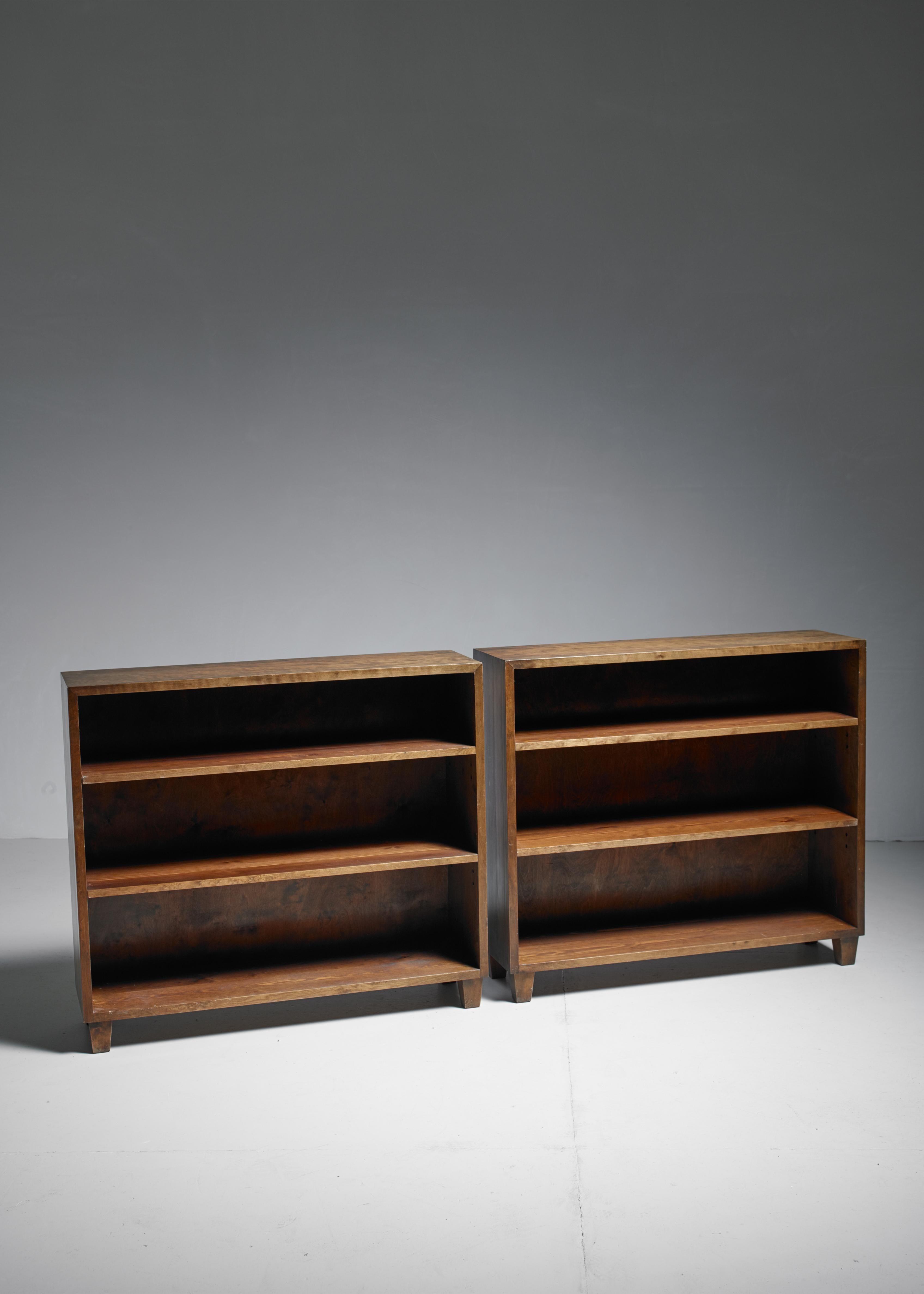 A pair of bookcases by Nordiska Kompaniet, made of birch and standing on four legs. 
These pieces are labeled by Nordiska with the serial number 44756, which indicates they were made in 1943.
 