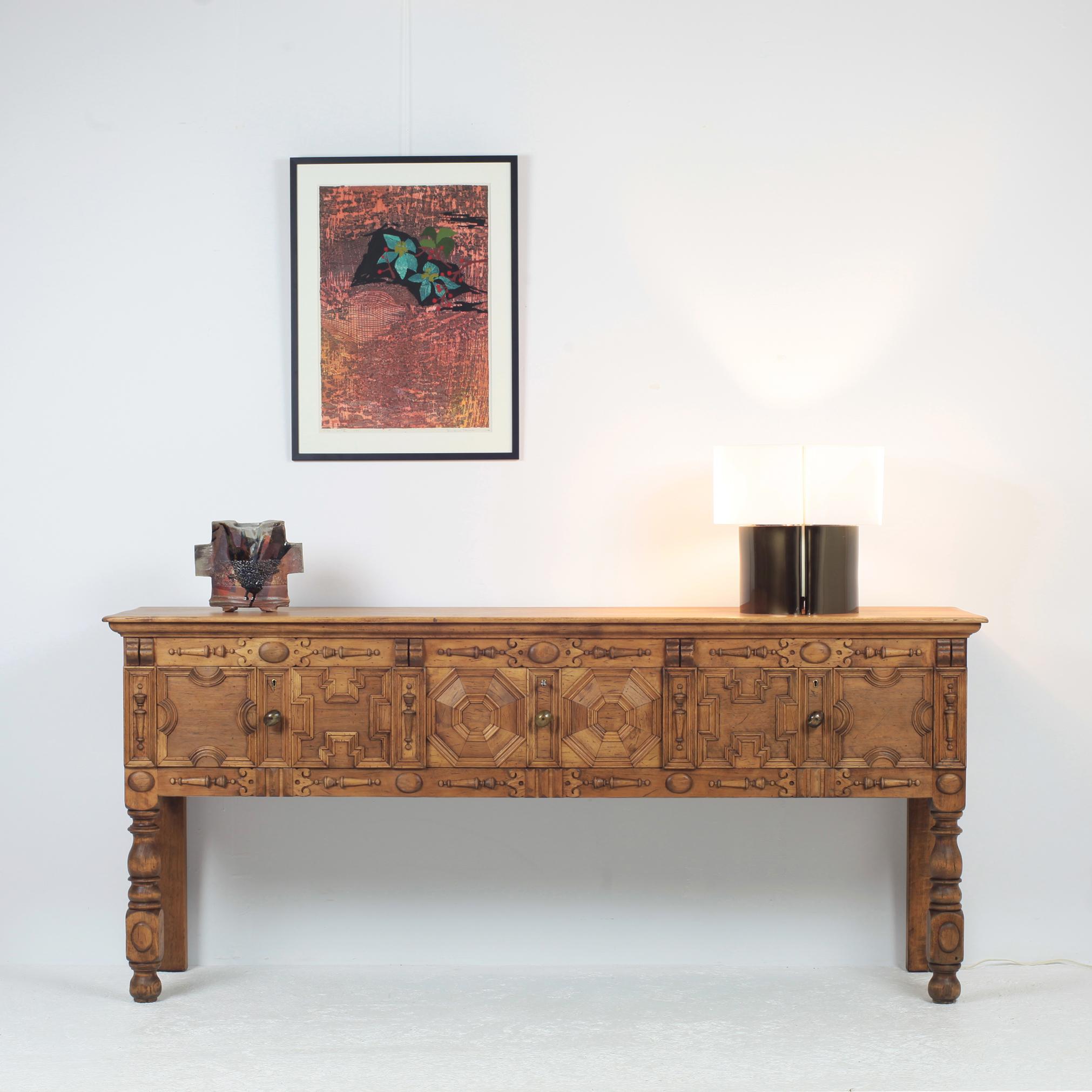 Nordiska Kompaniet credenza / sideboard / console table dated 1930.
Solid wood with sculpted decor.
Beautiful patina.
Manufacturer label on the back.