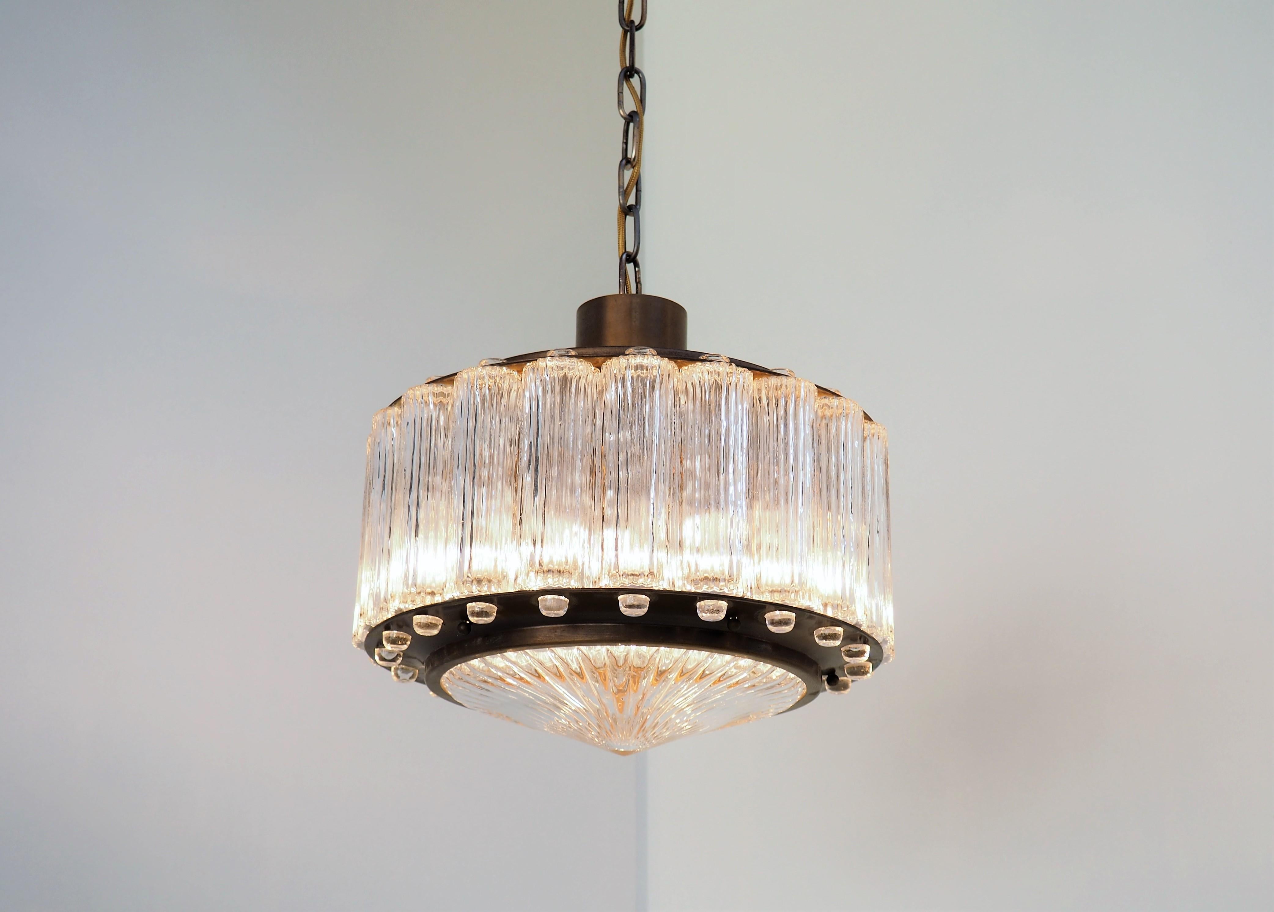 Exclusive and stunning cylindrical chandelier called “Nordlys” which means Northern lights. The chandelier is designed by Swedish designer Eric Wärnå for the Danish company Kemp & Lauritzen, and was only manufactured for a short period in the mid