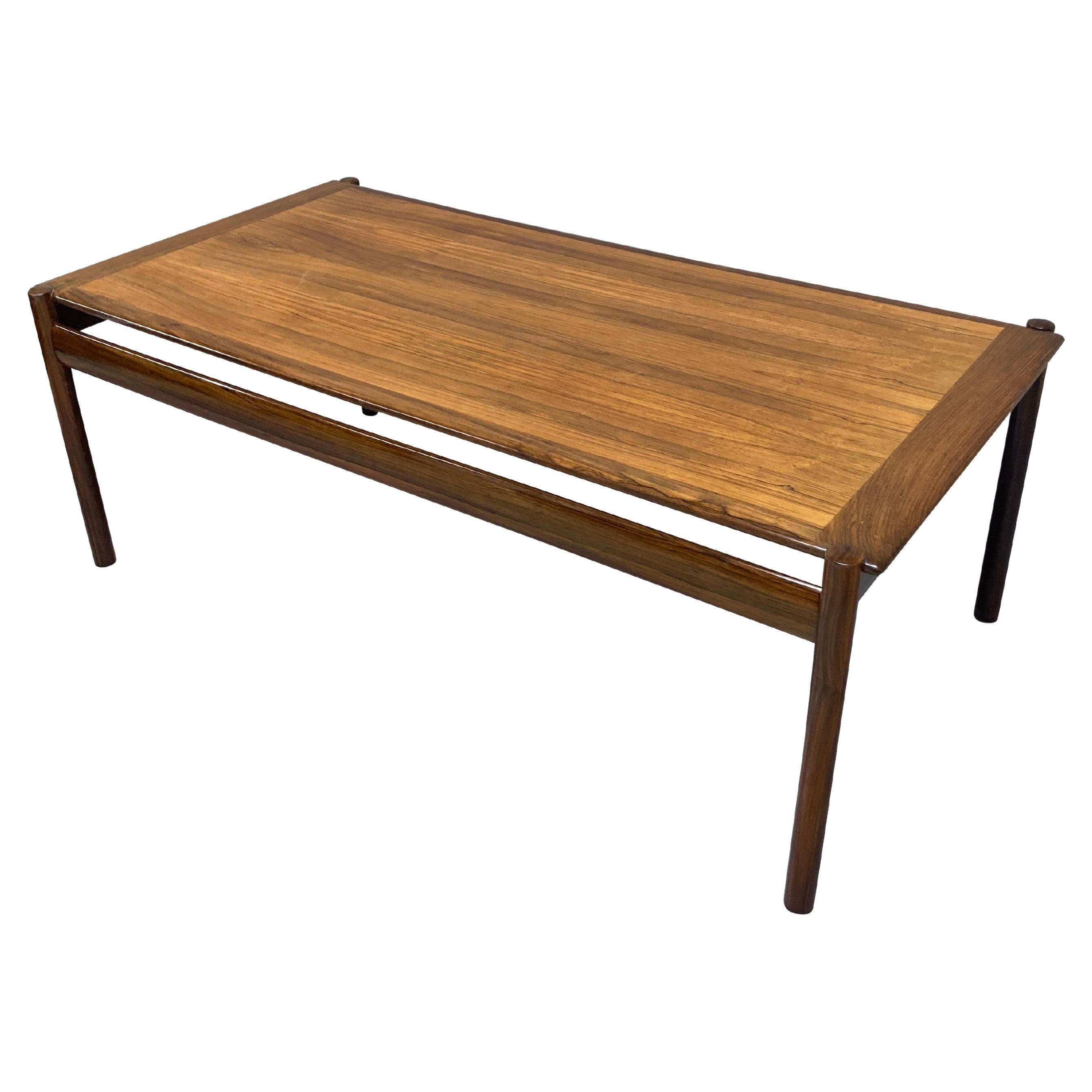 A large Norwegian occasional table in rosewood, of simple linear design by Dokka Mobler.