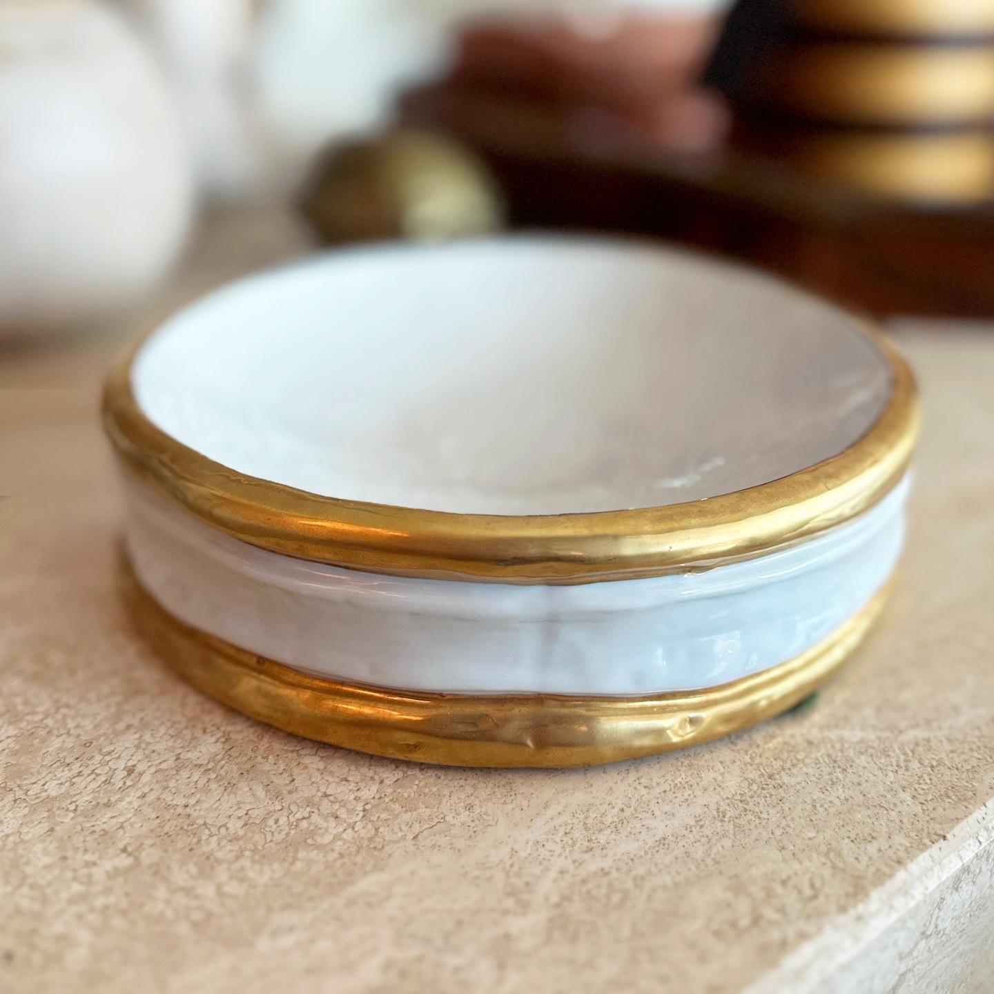 Circa 1980s Noritake Italy ceramic catchall or vide-poche designed and signed by Edoardo Tasca. Textured white porcelain ceramic with gold glazing stripes. Signed by artist on side and marked by manufacturer on the underside.  Makes the perfect