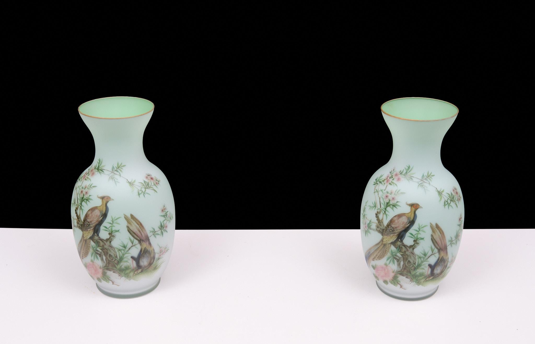 This is a Norleans, made in Italy Opaline hand painted vase. It features three pheasants with tree limbs with flowers. The inside is lime green and there is a gold colored border. It features three pheasants with tree limbs with flowers. The inside
