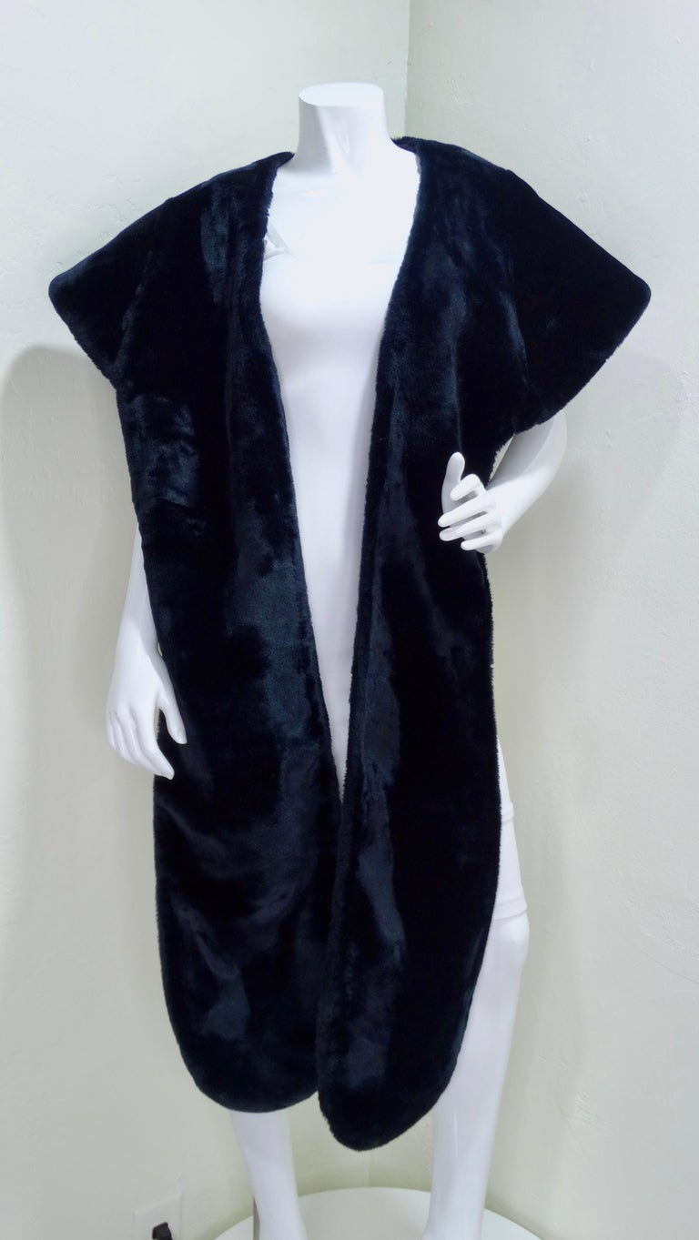 Norma Kamali is a pioneer in the fashion industry. According to her website, in the 1970's she created the sleeping bag coat on a camping trip that is still found on the racks in stores. This shawl is everything but your basic faux-fur shawl as t's