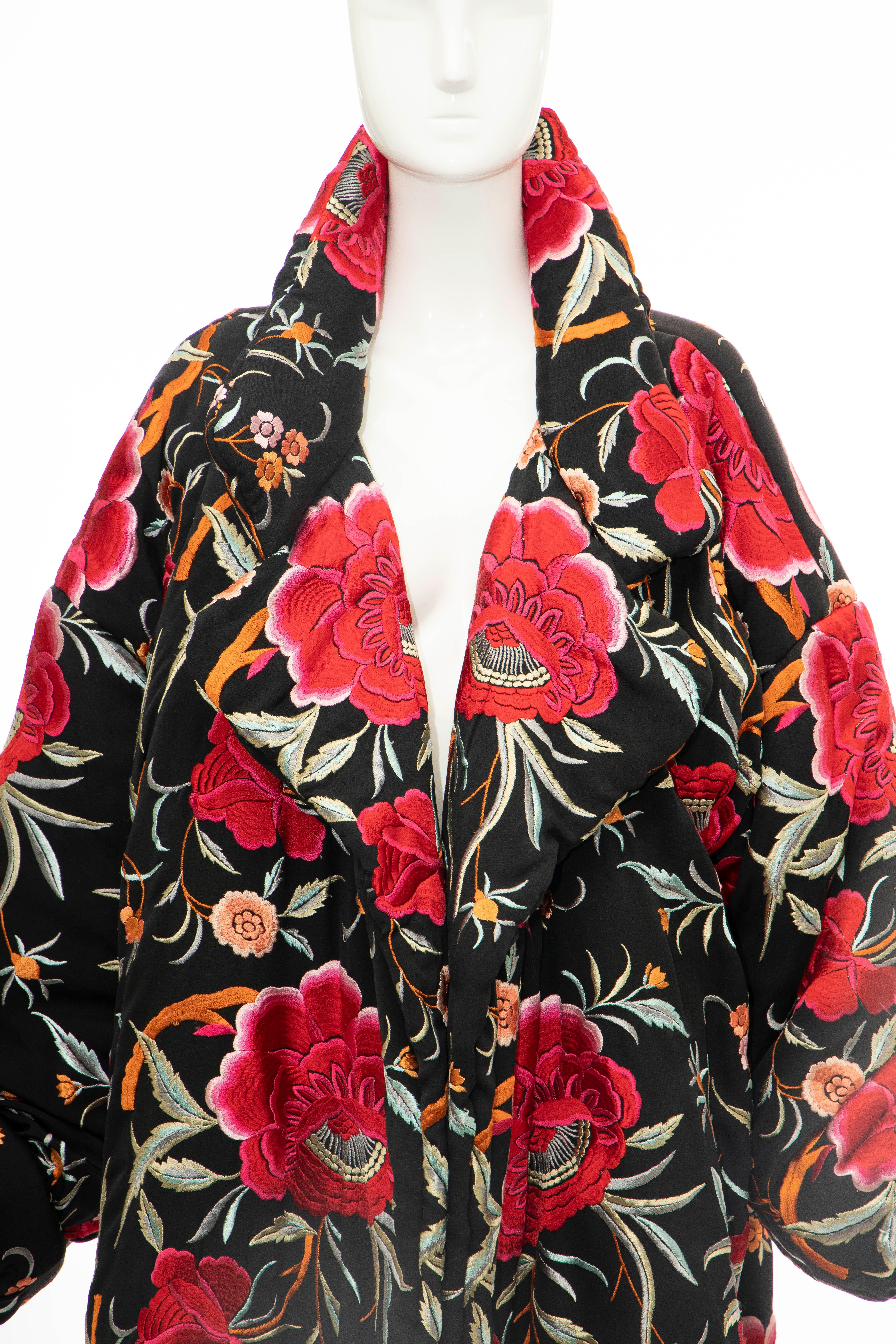 Norma Kamali, Circa: 1980's black floral embroidered cocoon coat with notched lapel, two pockets at side seams, open front and fully lined, 

Size not listed, estimated from measurements.

Size: Large

Bust: 48, Waist: 44, Shoulder: 20, Length: 35,