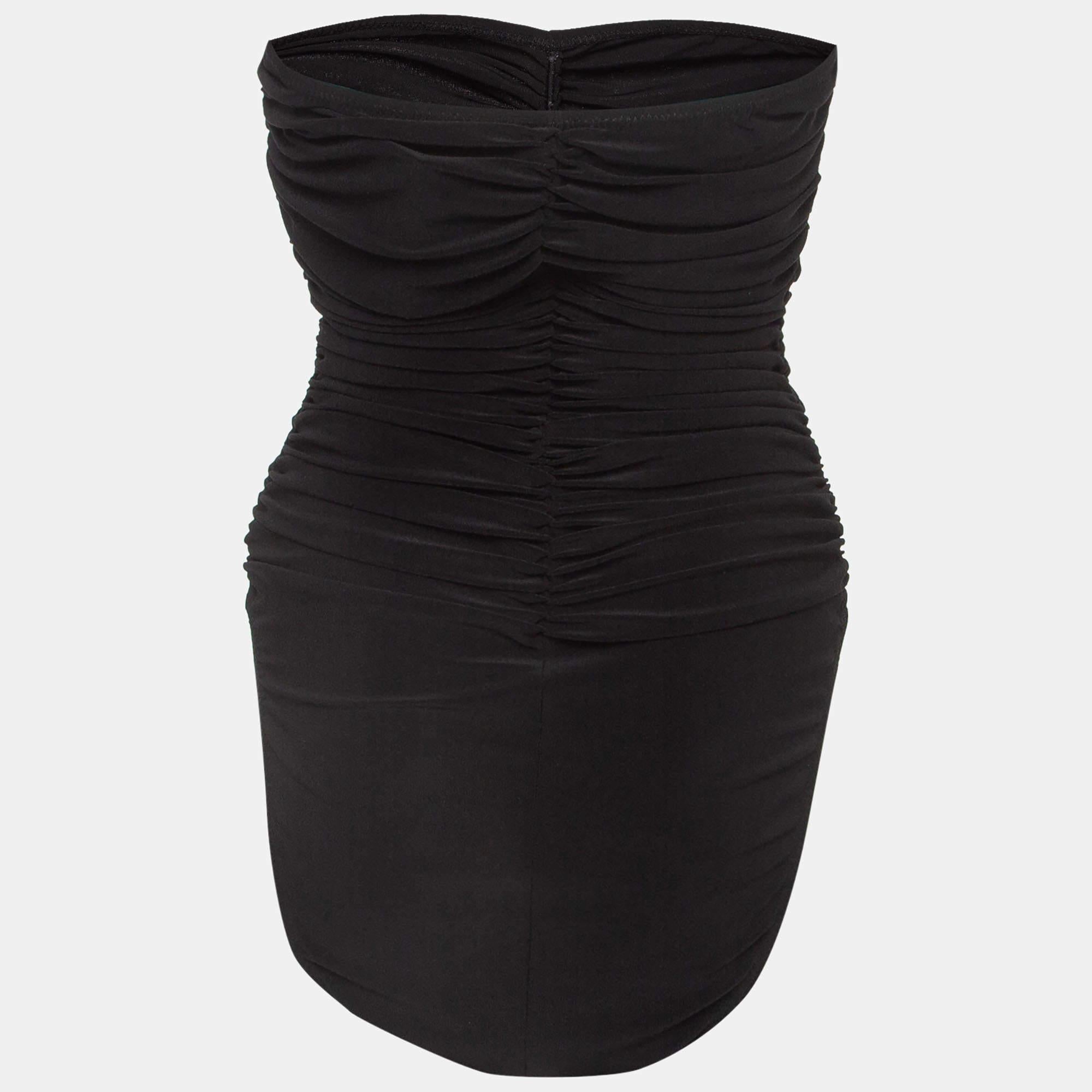 The Norma Kamali swimsuit exudes elegance with its classy black shade and flattering gathered detailing. The strapless design adds a touch of sophistication, making it a timeless and chic choice for any swimwear occasion.