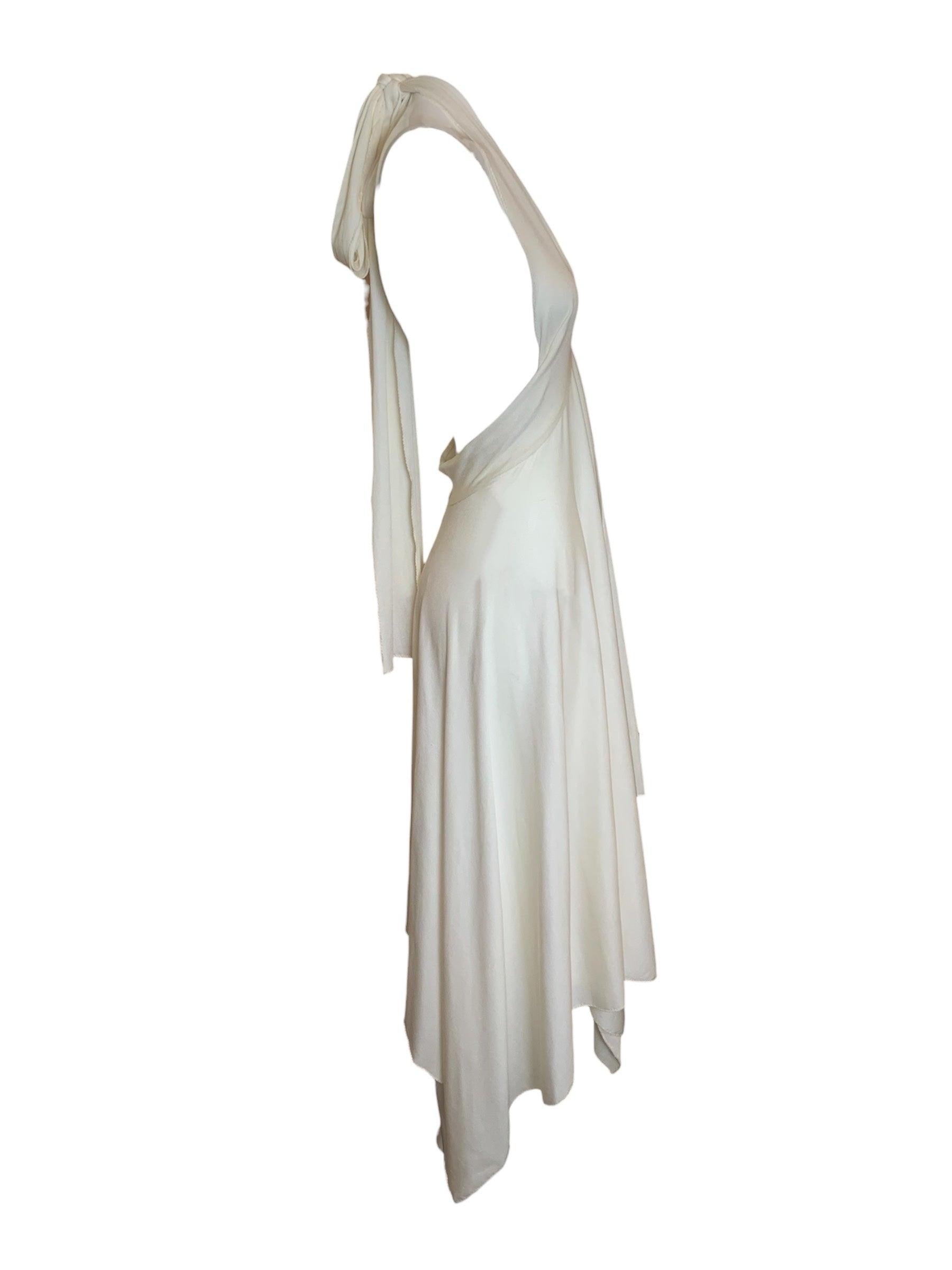 Sexy and sweet little disco dress from Norma Kamali. A fabulous dress that encapsulates a groundbreaking time in fashion history for American designers.  This fabulous halter disco silhouette from the 70s and is reminiscent of the Kamali dresses