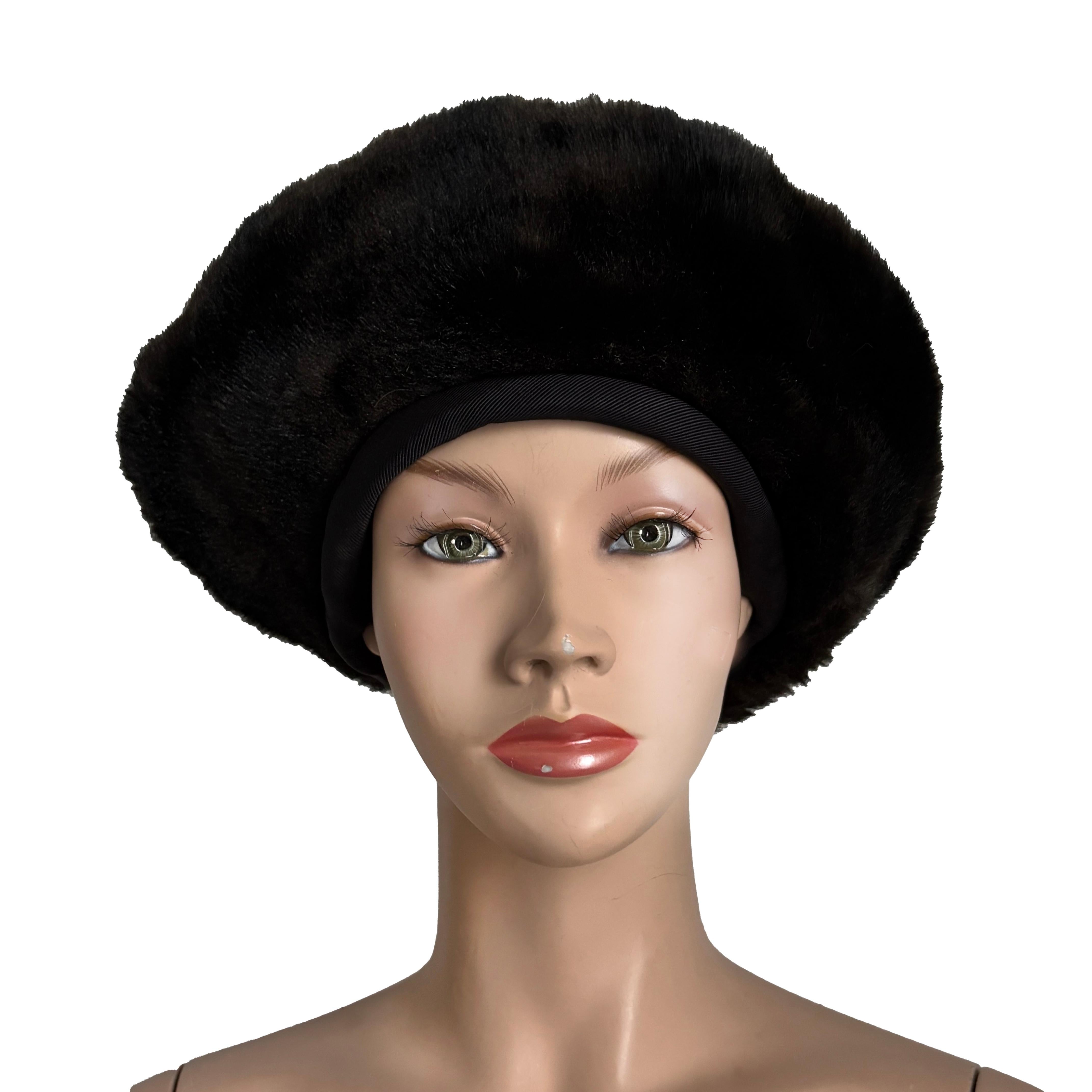 Preowned, vintage faux fur hat, designed by Norma Kamali for Stetson, most likely in the 1980s.  Made from grosgrain fabric, it features brown and black faux fur trim.  

Fabulous and chic - it's perfect for the cooler weather, or for any time you