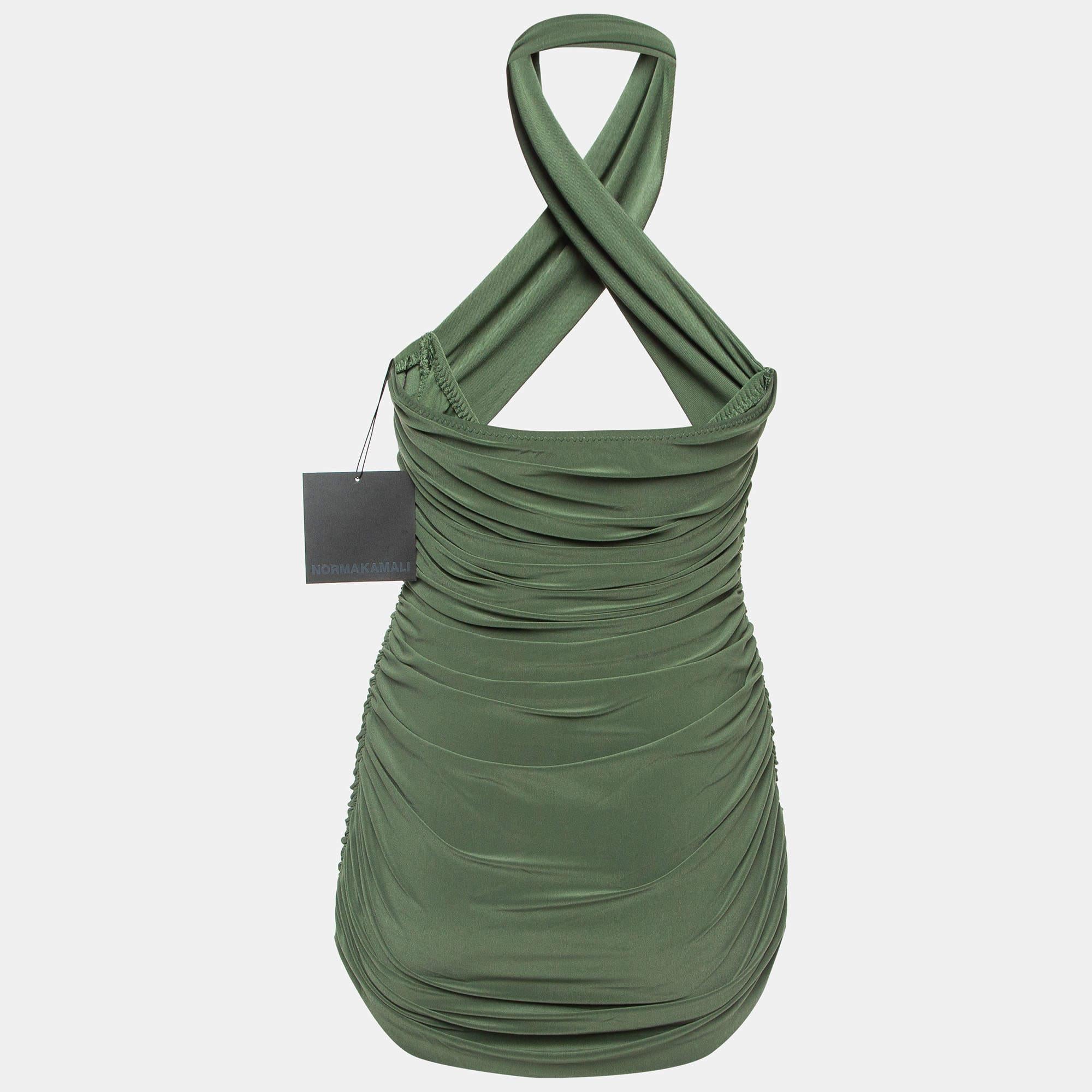 The Norma Kamali swimsuit exudes elegance with its green hue and flattering gathered details. The strapless design adds a touch of sophistication, making it a timeless and chic choice for any swimwear occasion.