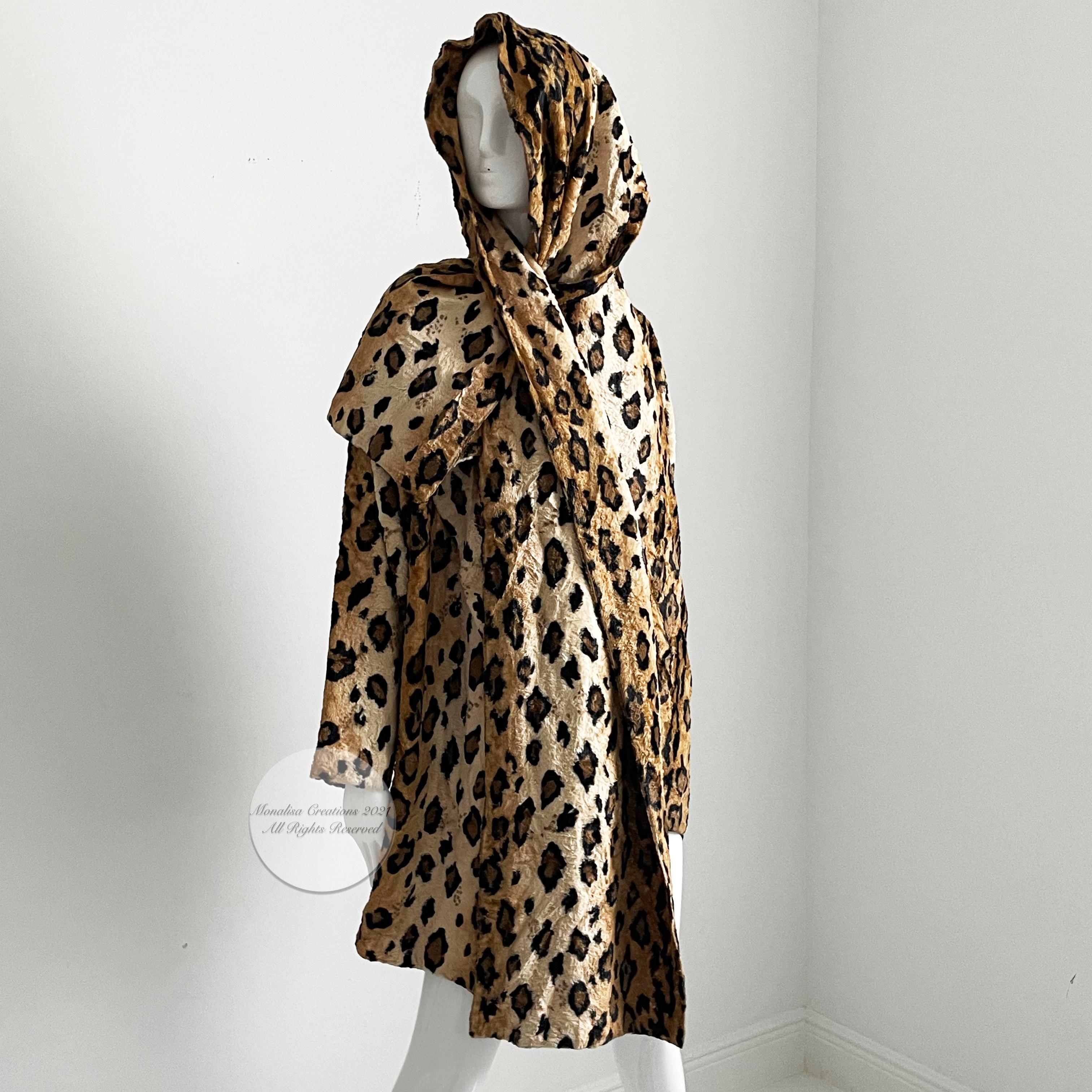 Authentic, preowned, vintage Norma Kamali leopard or tiger print shawl jacket, circa the early 90s. Faux fur leopard or tiger print fabric/fully-lined/dry clean only.  Open jacket with huge shawl collar, it has a slit opening on one side of collar,