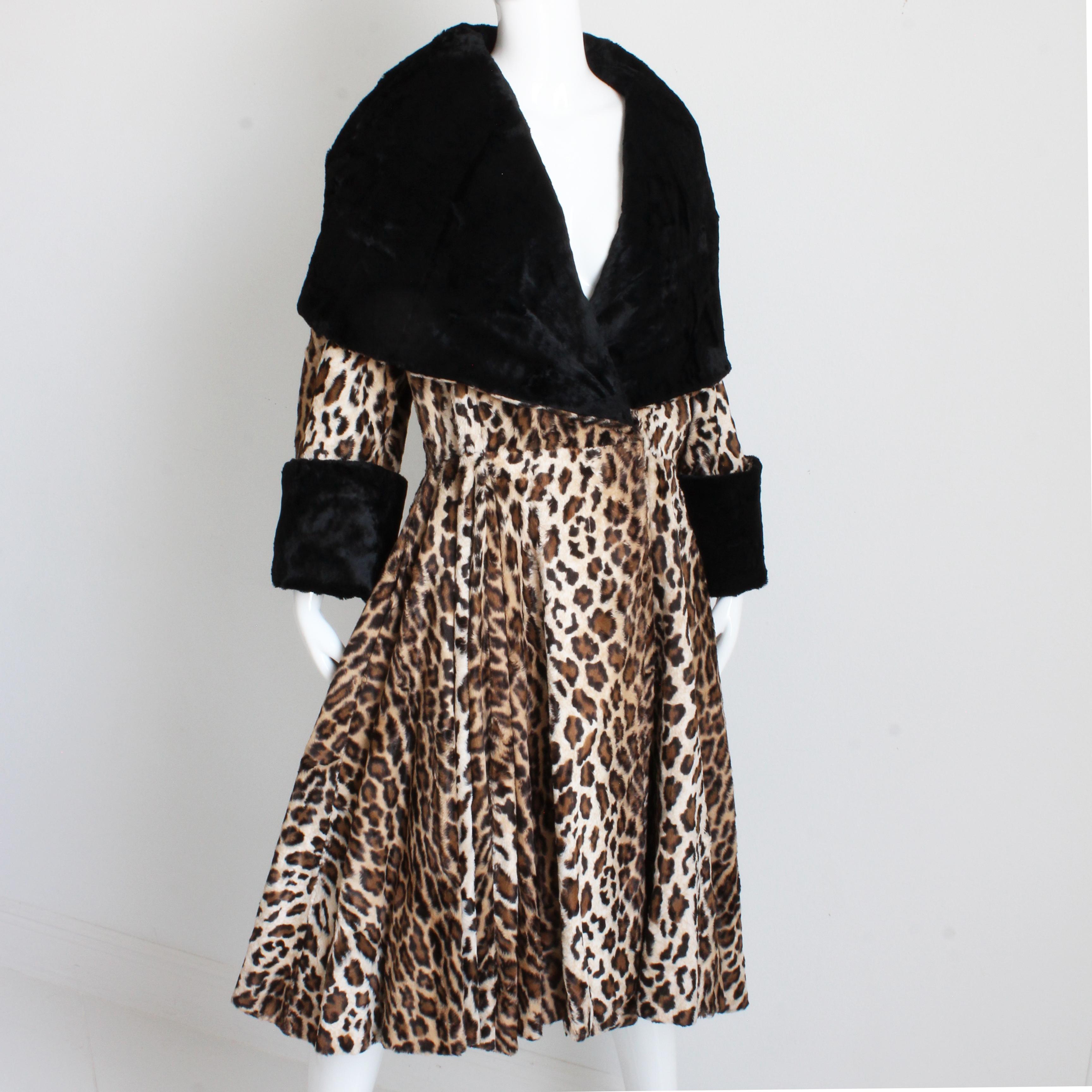 Authentic, preowned, vintage Norma Kamali OMO faux leopard fur coat with oversized shawl collar, likely made in the 80s.  Made from a supple faux leopard fur, it features black contrasting faux fur on the shawl collar lining and sleeve cuffs!  The