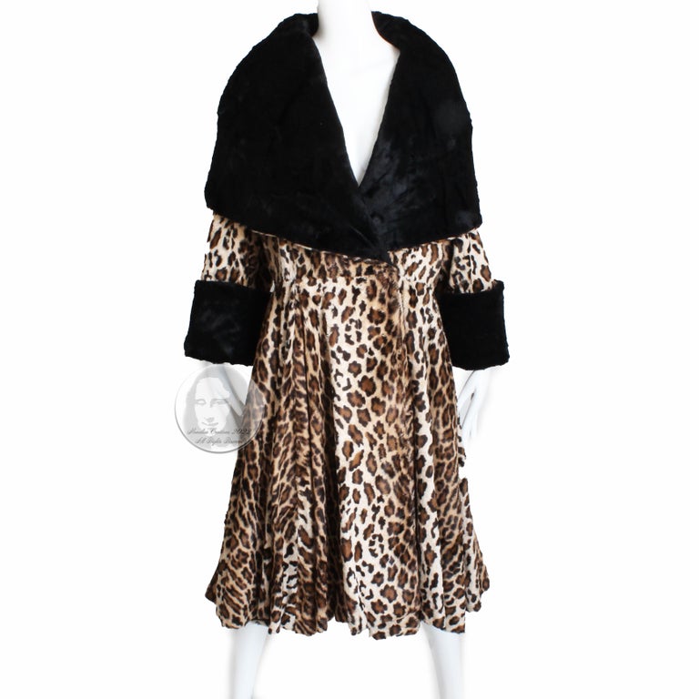 Authentic, preowned, vintage Norma Kamali OMO faux leopard fur coat with oversized shawl collar, likely made in the 80s.  Made from a supple faux leopard fur, it features black contrasting faux fur on the shawl collar lining and sleeve cuffs!  The